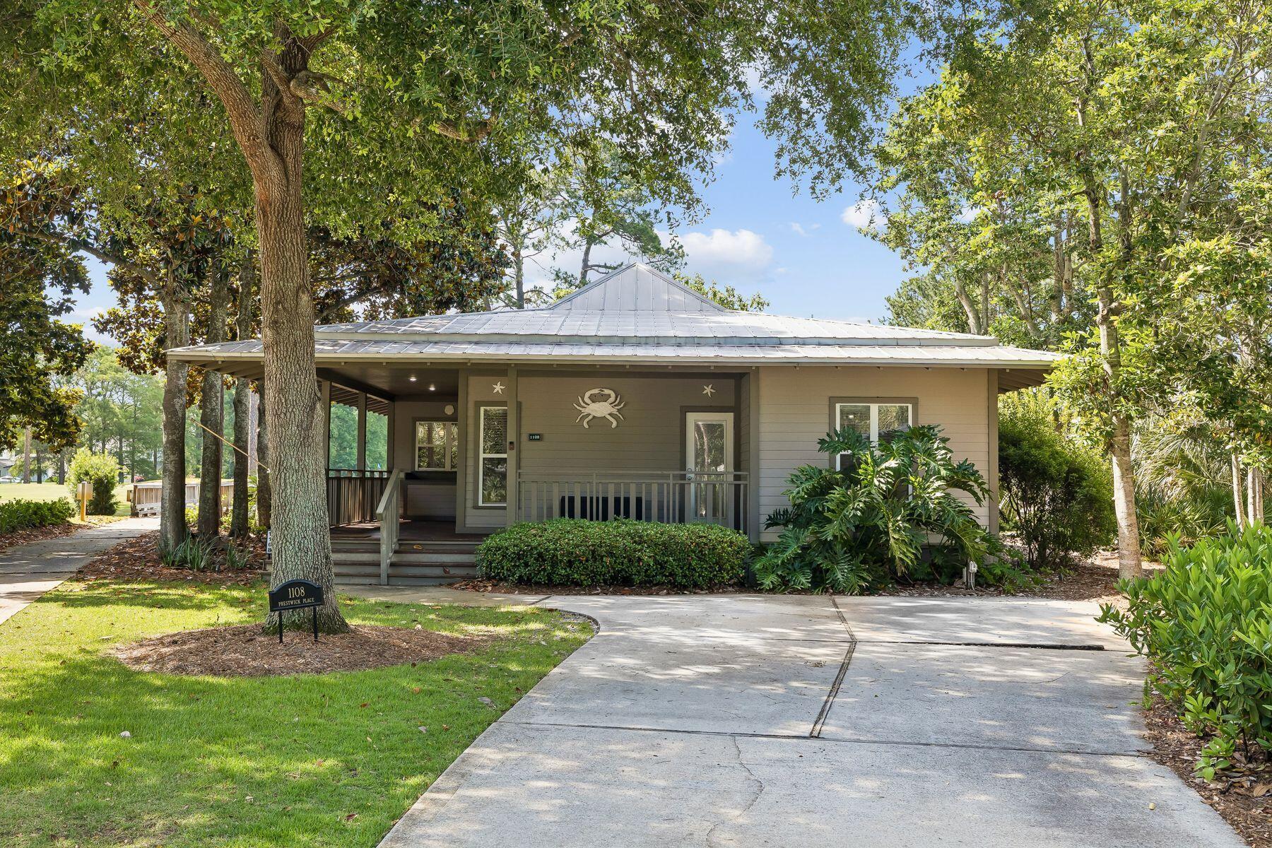 Motivated Seller! 2025 six seater golf cart now included!Wake up to peaceful lake views and the scenic 18th green of the Baytowne Golf Course from the comfort of your porch. Located in one of the most sought-after cottage-style neighborhoods within Sandestin Golf and Beach Resort, this charming 3-bedroom, 3-bath  one story home features an open floor plan with a spacious living area designed for relaxing and entertaining. The bright and airy living room showcases two sets of French doors that open to a large screened-in porch overlooking the lake, creating the perfect indoor-outdoor living space. The kitchen features granite countertops and stainless steel appliances. Two primary suites offer comfort and privacy; one opens directly to the porch and its tranquil lake views. Thoughtful landscape lighting enhances the home's charm and curb appeal in the evenings.  Whether you're searching for a second home or a full-time residence, this home presents an exceptional opportunity in a wonderful neighborhood. Conveniently located near Grand Boulevard at Sandestin, The Village of Baytowne Wharf, and the marina, you'll enjoy easy access to shopping, dining, entertainment, and recreation.