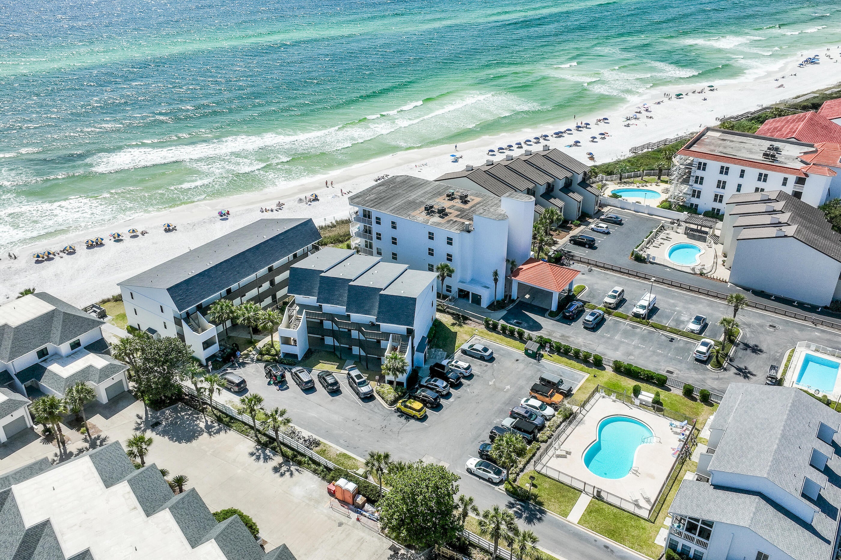 Gulf views, south of 30A, and fully renovated in the heart of Seagrove Beach.

This two-bedroom, two-and-a-half-bath townhome sits south of 30A about a mile east of Seaside, with southwest Gulf views from both balconies -- the best seat in the building at sunset.

Renovated in 2024 and 2025 with quality throughout. The 2025 kitchen features new cabinetry with custom hinged uppers, quartz counters, a farmhouse sink, undercabinet lighting, and new GE appliances with a Bosch dishwasher. All three baths have been redone with new vanities, quartz counters, tile, fixtures, and lighting, including a fully renovated first-level shower and a new glass shower door in the master. Luxury vinyl plank flooring on the first level and in the master, hardwood stairs, fresh paint throughout.

Held as a private second home and never placed on a rental program. The low wear shows in every room. Offered fully furnished and turnkey.

Fee simple ownership with owned land rather than a condominium interest -- a real advantage at financing. Two assigned parking spaces plus overflow, community pool access, and dues of $408 monthly. Sleeps six.

Walk or bike to Seaside, Seagrove's restaurants and shops, and the 30A trail. Dimensions and details deemed accurate; buyer to verify.
