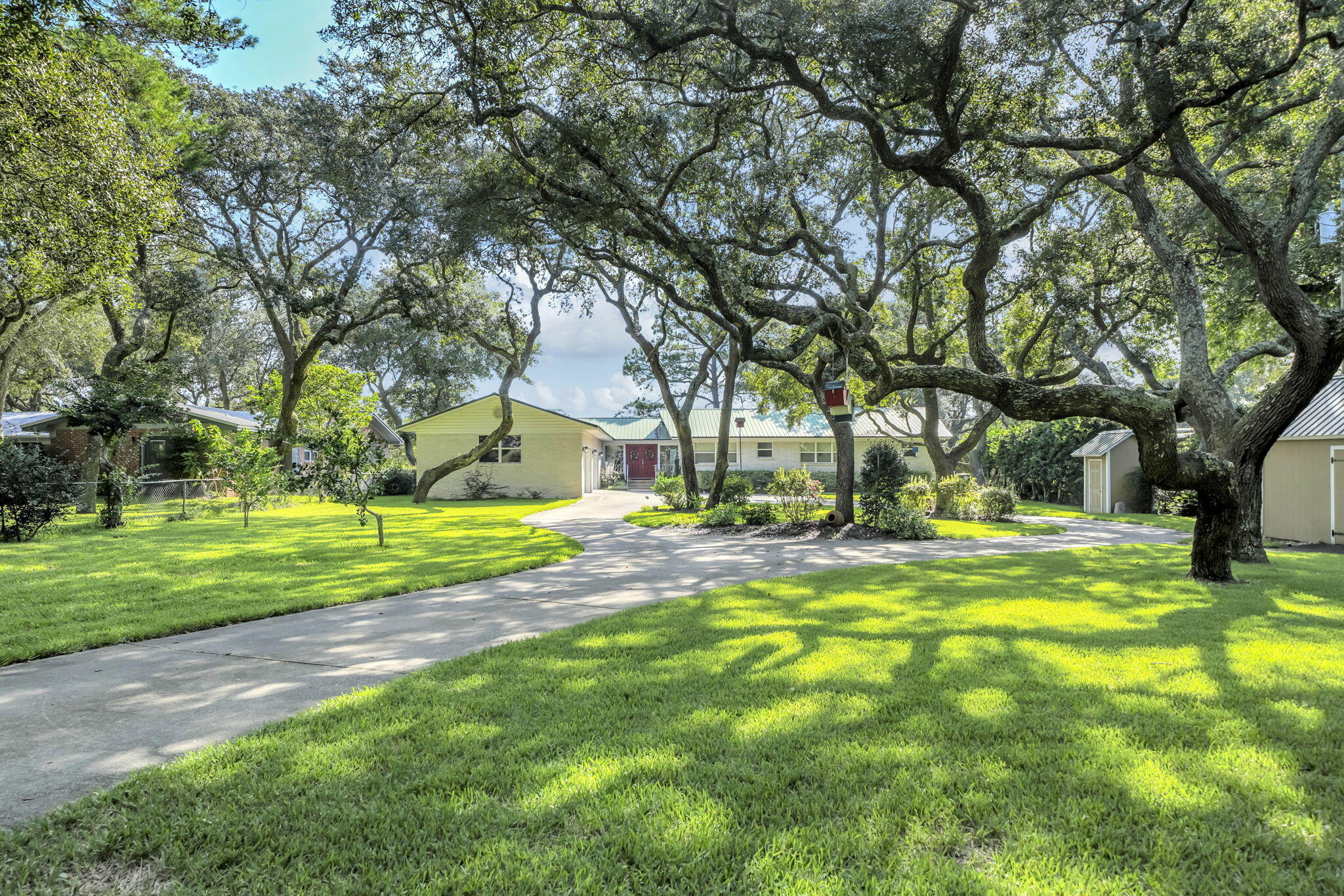 Nestled along the tranquil waters of Poquito Bayou, this waterfront home offers an unparalleled experience. With its deep water, dock, boat lift, and boathouse, it provides a serene escape from the hustle and bustle of everyday life.

This charming four-bedroom, three-bathroom brick home boasts breathtaking views from every common area, including the primary bedroom. The bayou views are among the most picturesque in Northwest Florida, offering abundant wildlife and a sense of tranquility. Imagine waking up to the sight of dolphins gracefully escaping the busy traffic of Choctawhatchee Bay, training their young, and swimming in peace.

Indulge in leisurely meals with the catch of the day, such as flounder and redfish, that swim right to your dock. For those seeking a private beach, this home offers a backyard oasis with its own personal beach and swimming hole.

Upon arrival, you will be greeted by a meticulously maintained lawn adorned with several majestic oak trees. The two-thirds-acre lot is fully fenced, providing a sense of security and privacy. A 20x10 shed offers ample storage, while a walk-in pump house ensures efficient irrigation. The home is one level with a walkout basement that offers the family entertainment room and a possible bedroom. 

The four-car garage, with its generous space for a workshop, sets this property apart from others. The home's elevation provides peace of mind and security, offering a stunning vantage point for enjoying the surrounding views. Throughout the home, impact windows and sliding glass doors exude a modern aesthetic, while the original 2008 remodel adds character and charm. Recent updates include, a refreshed front door in 2021, a renovated pump house in 2021, pavers on the patio in 2023, a circuit breaker panel in 2026, a redecked dock in 2025, a refrigerator in 2024, a dishwasher in 2026, a 5-ton HVAC system in 2021, and a 2-ton HVAC system in 2009. Metal roof was installed 2009 and has held up very well. 

The home has been meticulously maintained over the years, reflecting the dedication of its owners. Numerous additional projects undertaken by the seller have further enhanced its value.