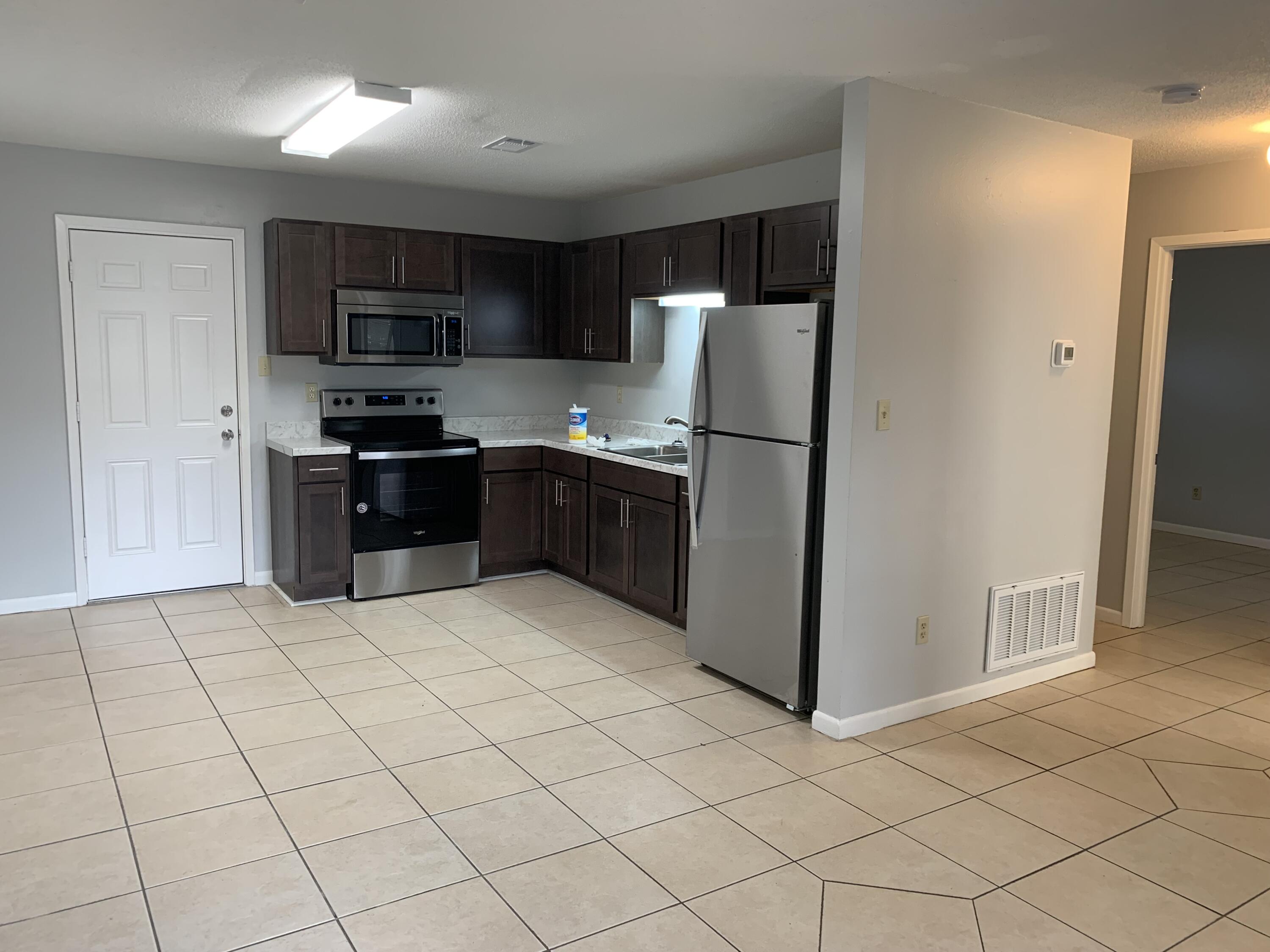 Graced with a prime location at 935 Tanager Road, C, in the vibrant heart of Fort Walton Beach, this charming multiplex rental offers an inviting blend of comfort and convenience. Step inside to discover a cozy 797 sq ft haven, where well-appointed spaces create a seamless flow for everyday living. The two-bedroom layout provides ample room for relaxation and personal expression, making it an ideal retreat for those seeking a balanced lifestyle. A full bathroom adds a touch of luxury, featuring modern fixtures that elevate your daily routines. The open-concept design ensures that natural light bathes every corner, creating an uplifting and warm atmosphere throughout. Whether you're enjoying a quiet evening in or hosting guests, the thoughtful layout accommodates your every need. This property's location offers easy access to local amenities, ensuring that dining, shopping, and recreational opportunities are just a stone's throw away. Set in a friendly community, it promises a welcoming environment where new memories are waiting to be made. Discover the perfect blend of location and lifestyle at this delightful Fort Walton Beach rental, where every detail is crafted to enhance your living experience.