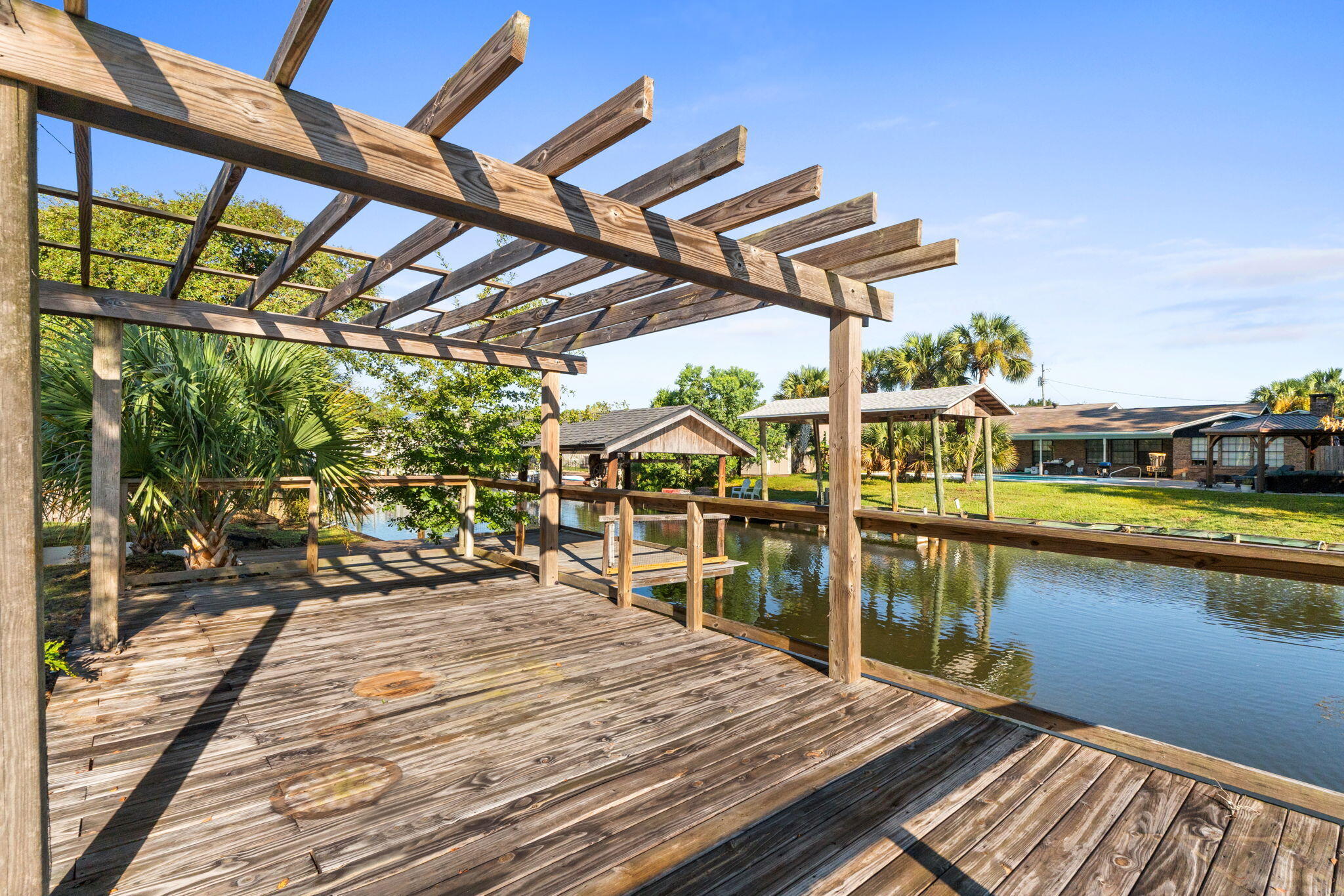 Let's Go!!
This waterfront home has been repositioned to reflect today's market and now represents one of the best waterfront values available.

 One level. One Owner. Built to be lived in and loved for generations. This WATERFRONT OPPORTUNITY now offers a brighter, more inviting feel. Relaxed coastal culture with a private pool, canal frontage, and a covered dock--perfect for fishing, boating, and unwinding by the water. Pack your picnic and head over to Shell Island. The residence features 4 bedrooms and 2.5 baths, including a flex room conveniently located just inside the entry from the drive-through garage, opening on both sides to create a porte-cochère style arrival and exit. Detached workshop/studio. No HOA restrictions. 
This NorthShore waterfront home is ready for its next chapter and offers an exceptional opportunity along the Emerald Coast. Top Features | Property Highlights
- Hidden panel Bosch dishwasher seamlessly integrated into the island for a sleek look and ultra-quiet performance
- Premium JennAir cooktop
- Brand new, never-used Samsung double-door microwave/convection oven
- Samsung refrigerator in like-new condition
- High-efficiency HVAC system
- New drywall with double insulation Top Features | Property Highlights
- Hidden panel Bosch dishwasher seamlessly integrated into the island for a sleek look and ultra-quiet performance
- Premium JennAir cooktop
- Brand new, never-used Samsung double-door microwave/convection oven
 - Samsung refrigerator in like-new condition
- High-efficiency HVAC system
- New drywall with double insulation