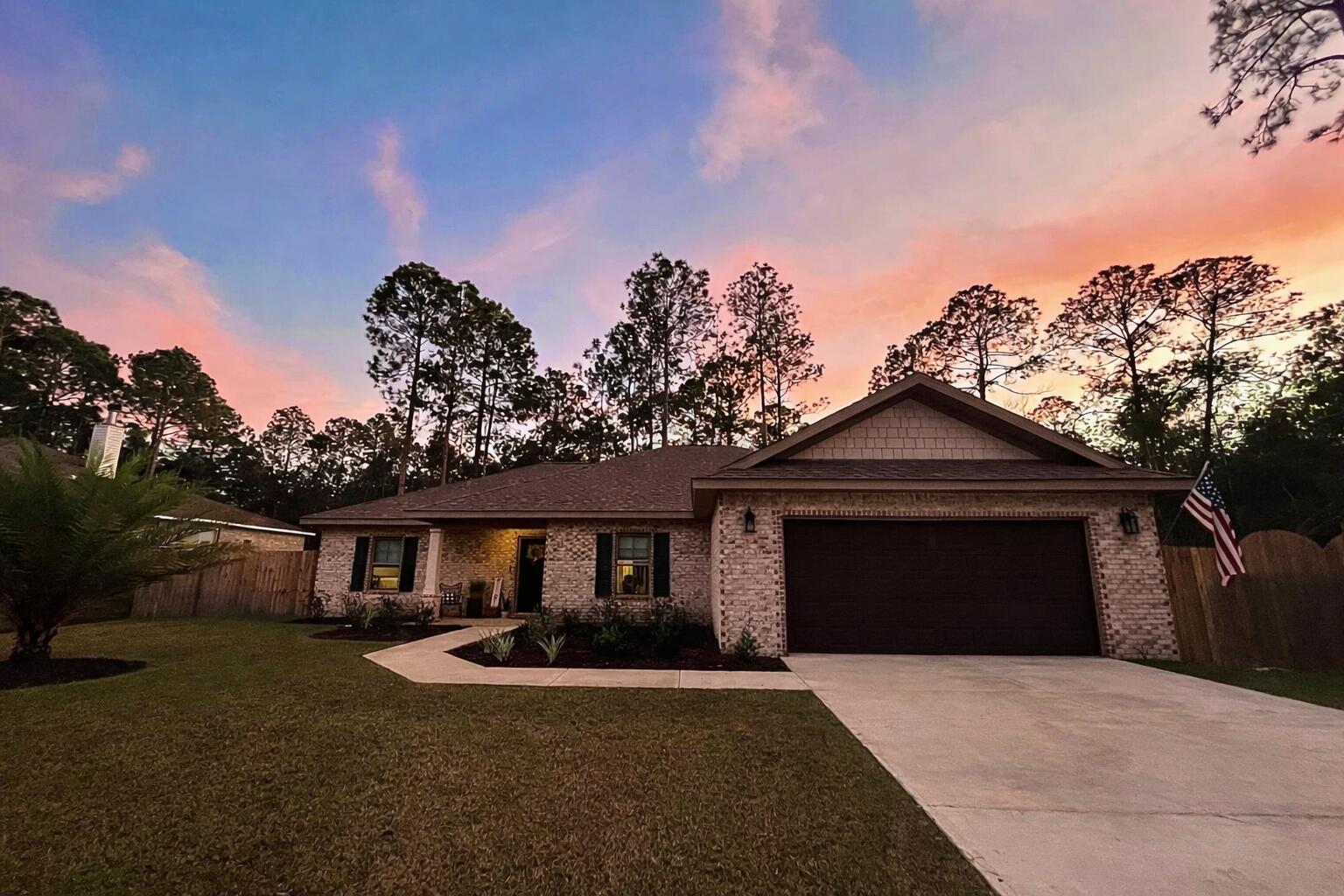 Welcome to this well-maintained 4-bedroom, 2-bath home in the desirable Holley By The Sea community in Navarre. This home features an open floor plan with abundant natural light, quartz countertops in the kitchen and bathrooms, and a private primary suite. Hurricane shutters provide added protection, and the home is currently being freshly painted for a refreshed look.

The property includes a custom privacy fence with a wide gate for boat or RV storage and a Rain Bird sprinkler system for easy lawn care. Enjoy access to Holley By The Sea's incredible 48-acre recreation center with pools, fitness center, tennis and pickleball courts, walking trails, soundside beach access, fishing pier, and more. Conveniently locat