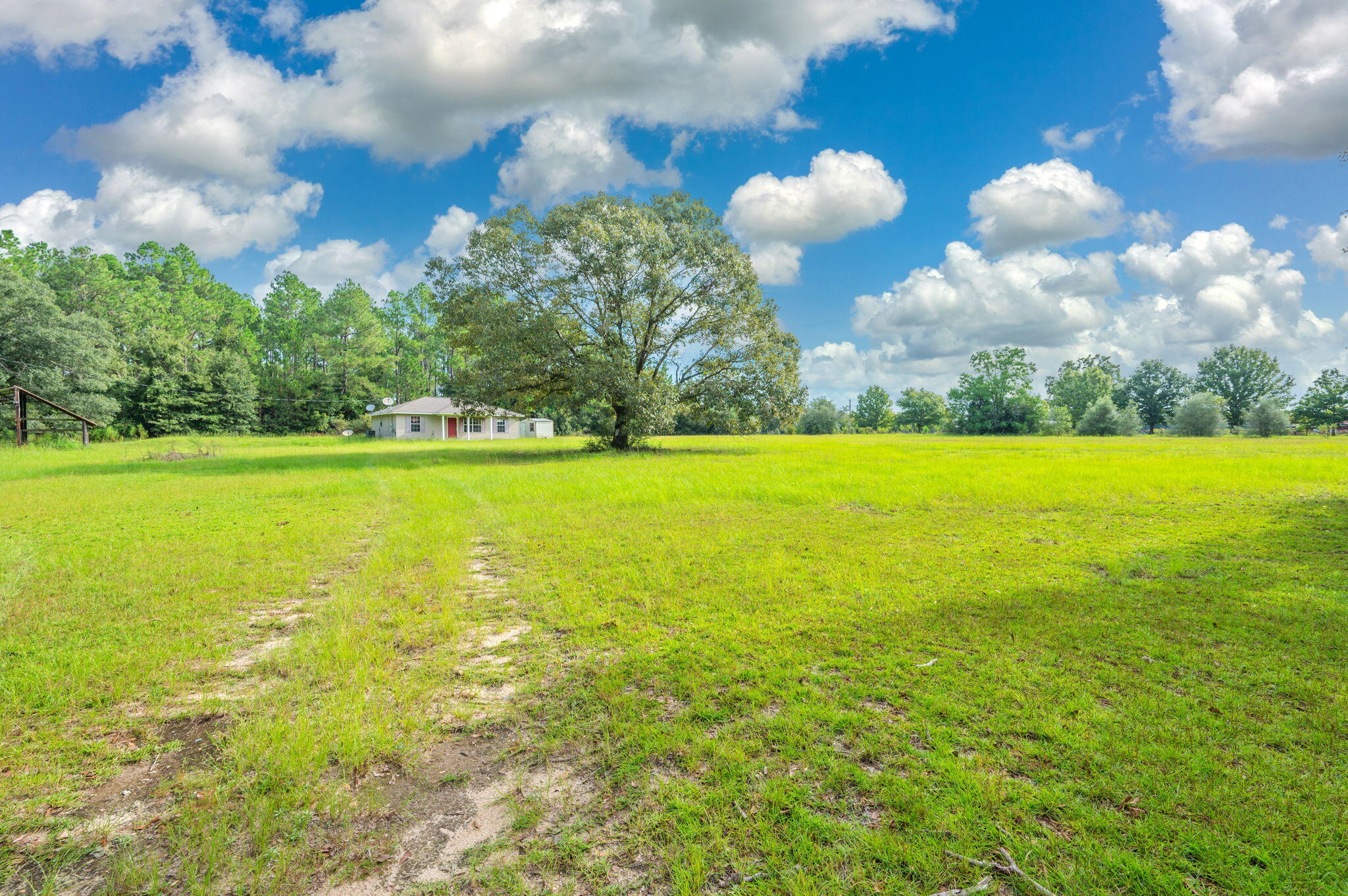 Peaceful Country Retreat Bordering Blackwater State Forest! This 3-bedroom, 2-bath home sits on 5 beautiful acres and offers a rare opportunity to enjoy privacy, space, and the serenity of the outdoors. Built in 2013, the home features a functional layout with plenty of potential to make it your own. With a little cosmetic updating, this property could become the perfect country retreat. The 5-acre parcel borders Blackwater State Forest on both the North and South sides, providing a beautiful natural backdrop and a true sense of seclusion. Whether you're looking for a quiet place to call home, a weekend getaway, or a property with room to grow, this one is worth a look!