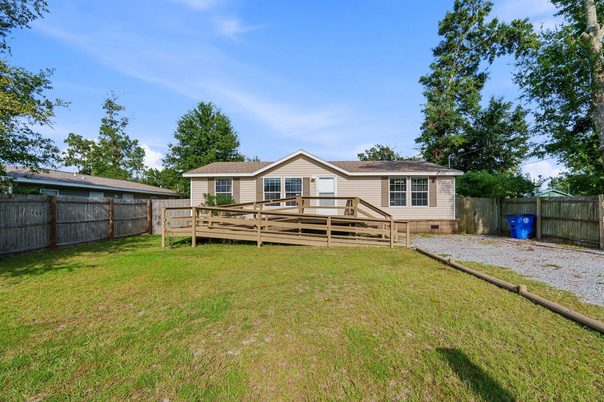 Welcome home to this charming 3-bedroom, 2-bath ranch nestled on a spacious quarter-acre lot! Freshly painted throughout in versatile neutral tones, this home offers a clean, welcoming backdrop ready to complement any style of décor. The spacious eat-in kitchen provides plenty of room for everyday meals and gatherings. The private primary suite features a walk-in closet and an en-suite bathroom complete with a relaxing corner garden tub and separate shower. Step outside to enjoy the large privacy-fenced backyard--perfect for entertaining, gardening, play, or simply relaxing outdoors. With its comfortable ranch-style layout, generous lot, and inviting updates, this home offers the space and flexibility you've been looking for. Don't miss the opportunity to make it yours!