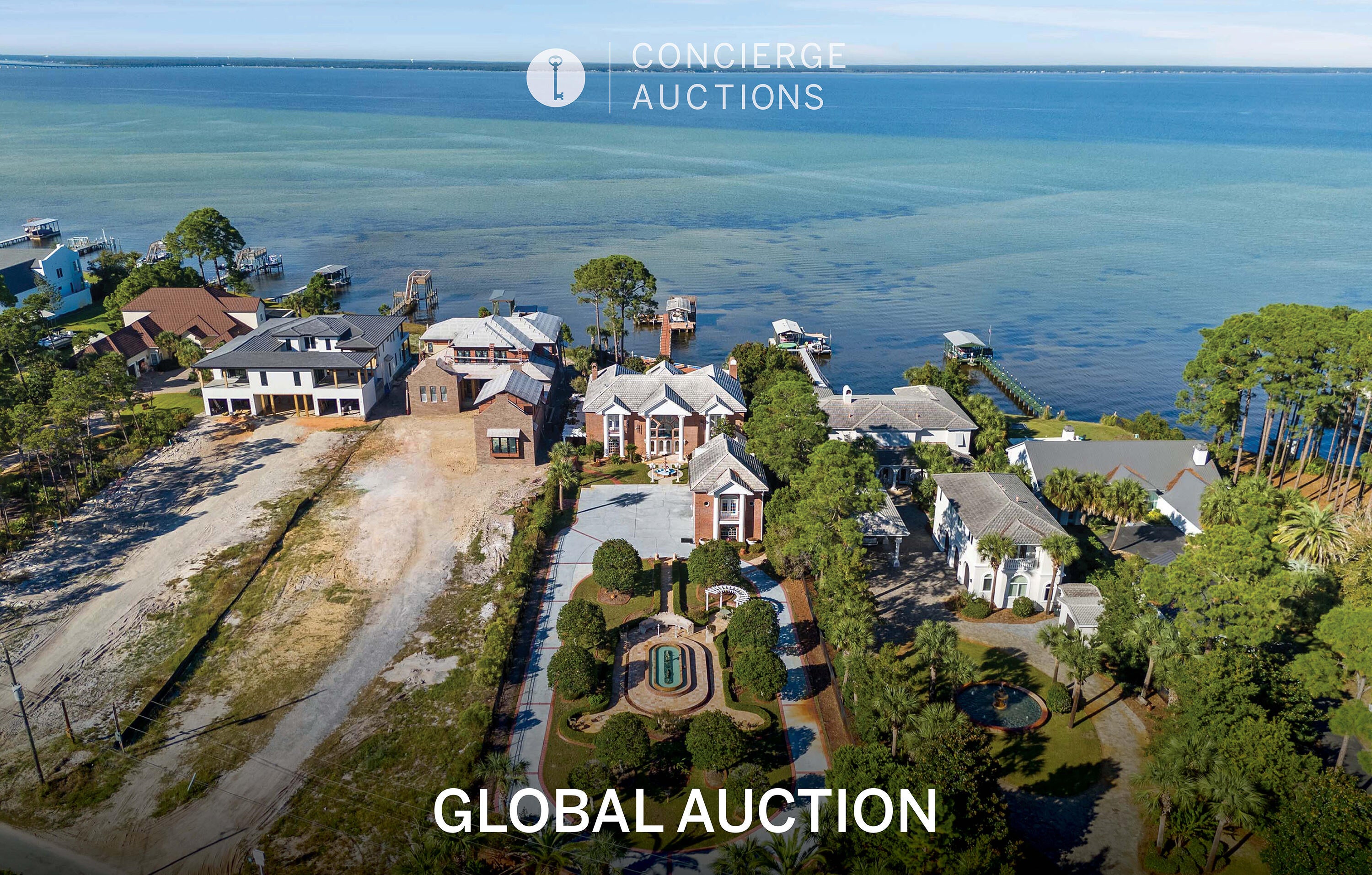 AUCTION: Bidder registration deadline: 22 September.  Starting bids expected between $1M-$2M.  An exceptional bayfront villa estate in Miramar Beach pairs old-world craftsmanship with refined coastal living. Two hand carved curved staircases, a coffered ceiling with stained glass, and Italian marble floors set an unmistakable tone from the moment of arrival. Immaculate gated grounds welcome with mosaic fountains, marble statuary, and manicured gardens, while a built-in bar imported from England anchors the billiards room and den. A heated atrium pool, private dock with covered boat lift, and 107 feet of seawall protected waterfront invite effortless entertaining and quiet reflection alike. A separate guest cottage above the four-car garage completes an estate built for gracious bay front living. Columns greet you as you walk up to the home, and once inside you are greeted by 2 exquisite curved staircases, each accented by hand carved wood and under the grandest coffered ceiling with stained glass and Italian marble floors you have EVER seen. The ground floor master suite leaves nothing to be desired with a sitting area that features floor to ceiling glass to take in the breathtaking bay views. The master bath features include a jetted soaking tub, steam shower, oversized vanity, all encompassed in imported hand chosen marble. The formal living room features a grand piano and gas fireplace and leads into the chef's kitchen that offers an oversized island, custom cabinetry, and a fireplace that could easily be converted into a pizza oven! Adjacent to the kitchen is an additional sunlit interior full bar and summer kitchen with a high end grilling area (and original Wyland glass built in picture window valued at $10,000) that looks out into the enclosed heated atrium style pool and hot tub that were built into a covered brick alcove with arches, a bridge, jacuzzi and balconies, all overlooking the bay. The second floor offers 2 oversized bedroom suites with their own en-suite bathrooms, as well as a billiards room and den with a bar imported from England that rivals any exclusive private membership club. The coffered ceilings and woodwork rival any European castle or estate. A spiral staircase leads to a serene third floor sitting room perfect to get away from it all, with more breathtaking views of the bay for you to enjoy either inside or from the private balcony. Above the 4 car climate controlled garage you find the oversized guest cottage that offers a large living area/bedroom, additional bedroom with tongue and groove cathedral ceilings, a small kitchen, dedicated pantry, and 2 full bathrooms. Most of the windows in the home have been replaced in the last 2 years. Stepping out into the backyard of this incredible estate you will find intricate landscaping, marble gazebos, swings, a koy pond, and landscape lighting all leading to 107 feet of seawall protected waterfront. The private dock includes a covered boat lift, 2 jet ski lifts, canoe launch, and a second story rooftop sundeck that is guaranteed to provide stunning bay views and breathtaking sunsets. In total you have 7 fountains, 8 A/C units (3 are newer) and the most marble and detailed crown molding that you will ever see in a home of this size. With too many features to list, this estate/villa has it all and needs to be seen to be truly appreciated. All furniture is negotiable. All information is approximate and should be verified by buyers if important.