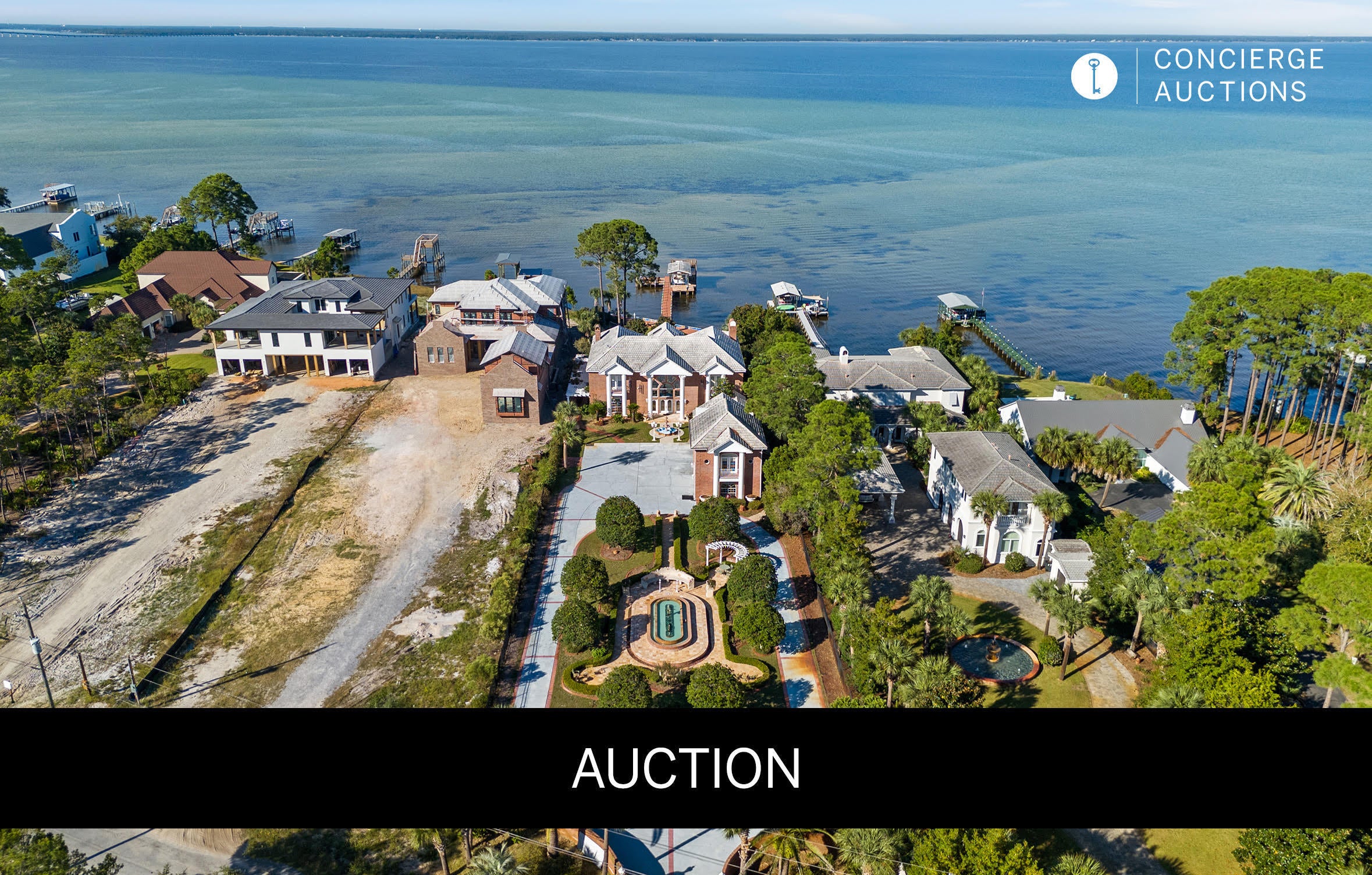 AUCTION: Bidder registration deadline: 16 September.  Starting bids expected between $1M-$2M.  An exceptional bayfront villa estate in Miramar Beach pairs old-world craftsmanship with refined coastal living. Two hand carved curved staircases, a coffered ceiling with stained glass, and Italian marble floors set an unmistakable tone from the moment of arrival. Immaculate gated grounds welcome with mosaic fountains, marble statuary, and manicured gardens, while a built-in bar imported from England anchors the billiards room and den. A heated atrium pool, private dock with covered boat lift, and 107 feet of seawall protected waterfront invite effortless entertaining and quiet reflection alike. A separate guest cottage above the four-car garage completes an estate built for gracious bay front living. Columns greet you as you walk up to the home, and once inside you are greeted by 2 exquisite curved staircases, each accented by hand carved wood and under the grandest coffered ceiling with stained glass and Italian marble floors you have EVER seen. The ground floor master suite leaves nothing to be desired with a sitting area that features floor to ceiling glass to take in the breathtaking bay views. The master bath features include a jetted soaking tub, steam shower, oversized vanity, all encompassed in imported hand chosen marble. The formal living room features a grand piano and gas fireplace and leads into the chef's kitchen that offers an oversized island, custom cabinetry, and a fireplace that could easily be converted into a pizza oven! Adjacent to the kitchen is an additional sunlit interior full bar and summer kitchen with a high end grilling area (and original Wyland glass built in picture window valued at $10,000) that looks out into the enclosed heated atrium style pool and hot tub that were built into a covered brick alcove with arches, a bridge, jacuzzi and balconies, all overlooking the bay. The second floor offers 2 oversized bedroom suites with their own en-suite bathrooms, as well as a billiards room and den with a bar imported from England that rivals any exclusive private membership club. The coffered ceilings and woodwork rival any European castle or estate. A spiral staircase leads to a serene third floor sitting room perfect to get away from it all, with more breathtaking views of the bay for you to enjoy either inside or from the private balcony. Above the 4 car climate controlled garage you find the oversized guest cottage that offers a large living area/bedroom, additional bedroom with tongue and groove cathedral ceilings, a small kitchen, dedicated pantry, and 2 full bathrooms. Most of the windows in the home have been replaced in the last 2 years. Stepping out into the backyard of this incredible estate you will find intricate landscaping, marble gazebos, swings, a koy pond, and landscape lighting all leading to 107 feet of seawall protected waterfront. The private dock includes a covered boat lift, 2 jet ski lifts, canoe launch, and a second story rooftop sundeck that is guaranteed to provide stunning bay views and breathtaking sunsets. In total you have 7 fountains, 8 A/C units (3 are newer) and the most marble and detailed crown molding that you will ever see in a home of this size. With too many features to list, this estate/villa has it all and needs to be seen to be truly appreciated. All furniture is negotiable. All information is approximate and should be verified by buyers if important.