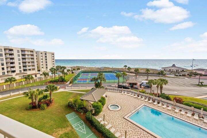 Experience coastal living at its finest in this stunning 2-bedroom Gulf view condo in the heart of Destin. Perfectly positioned to showcase unforgettable Emerald Coast sunsets, this exceptional property offers the ideal blend of relaxation, comfort, and investment potential.  Whether you're searching for a second home, vacation getaway, or income-producing property with a history of repeat guests, this condo checks every box. Inside, you'll find a spacious open layout featuring beautiful maintenance-free wood-look tile flooring throughout, creating a stylish and low-maintenance retreat.  Designed for entertaining and easy beachside living, the generous living spaces flow seamlessly onto your private balcony -- the perfect spot to unwind while enjoying panoramic Gulf views and breathtaking sunsets night after night.  This is your  opportunity to own a slice of paradise in one of Florida's most sought-after beach  destinations. This unit is truly a MUST SEE!