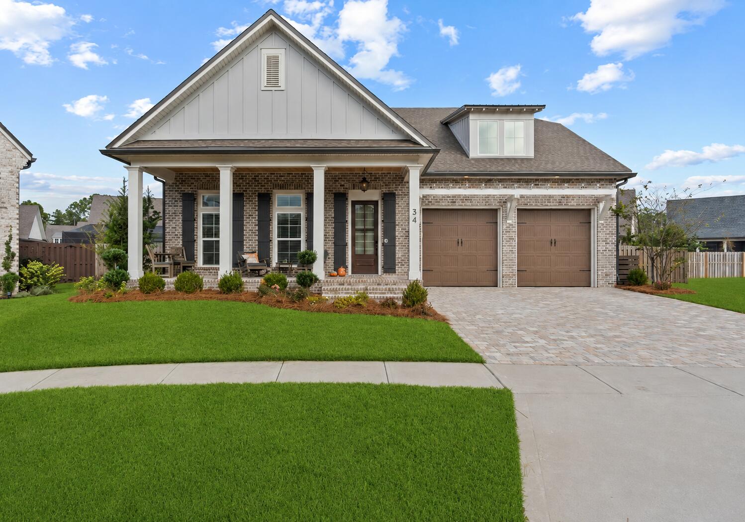 34 Caymus Cove - Vineyards at Hammock Bay
Experience exceptional craftsmanship and timeless design in this stunning Randy Wise Homes custom residence, now offered as the best value in the highly sought-after gated community of Vineyards at Hammock Bay. Perfectly positioned on an oversized cul-de-sac lot, this luxury home combines elegant finishes, functional living spaces, and outstanding outdoor entertaining.
A welcoming front porch with a stained wood ceiling and herringbone brick flooring creates an impressive first impression. Inside, the foyer showcases custom built-in shelving and a striking brick archway, setting the tone for the quality craftsmanship found throughout. Rich wood flooring flows seamlessly across the main living areas, while the dining room features a beautiful exposed brick accent wall that adds warmth and character.
Designed with both entertaining and everyday living in mind, the spacious gourmet kitchen offers abundant prep and storage space, cabinetry extending to the ceiling, premium Cambria quartz countertops, and an oversized island that serves as the heart of the home.
The luxurious primary suite is a private retreat featuring a spa-inspired bath with Cambria quartz countertops, a freestanding soaking tub, and an oversized walk-in shower. Two exceptionally large walk-in closets include custom built-in shelving and drawer systems, providing outstanding organization and storage.
Outdoor living is equally impressive with a large screened lanai . . . featuring a beautiful stained wood ceiling and a fully equipped summer kitchen, creating the perfect space for year-round entertaining. Beyond the lanai, the oversized homesite provides ample room to design and build the custom pool of your dreams while still maintaining generous green space, making this one of the most desirable lots in the community.
Additional highlights include a thoughtfully designed mudroom with built-in bench, coat rack, and convenient powder bath, spacious secondary bedrooms, and a versatile bonus room complete with a full bath that can easily be converted into a luxurious private guest suite, home office, media room, or multi-generational living space.
Offering luxury finishes, exceptional craftsmanship, and one of the finest homesites in the community, 34 Caymus Cove is an outstanding opportunity to own a custom Randy Wise home in one of Hammock Bay's most desirable gated neighborhoods. From the oversized lot and resort-style outdoor living potential to the extensive custom finishes throughout, this home delivers an exceptional lifestyle and remarkable value.
Schedule your private showing today and discover why this is the best value in Vineyards at Hammock Bay.