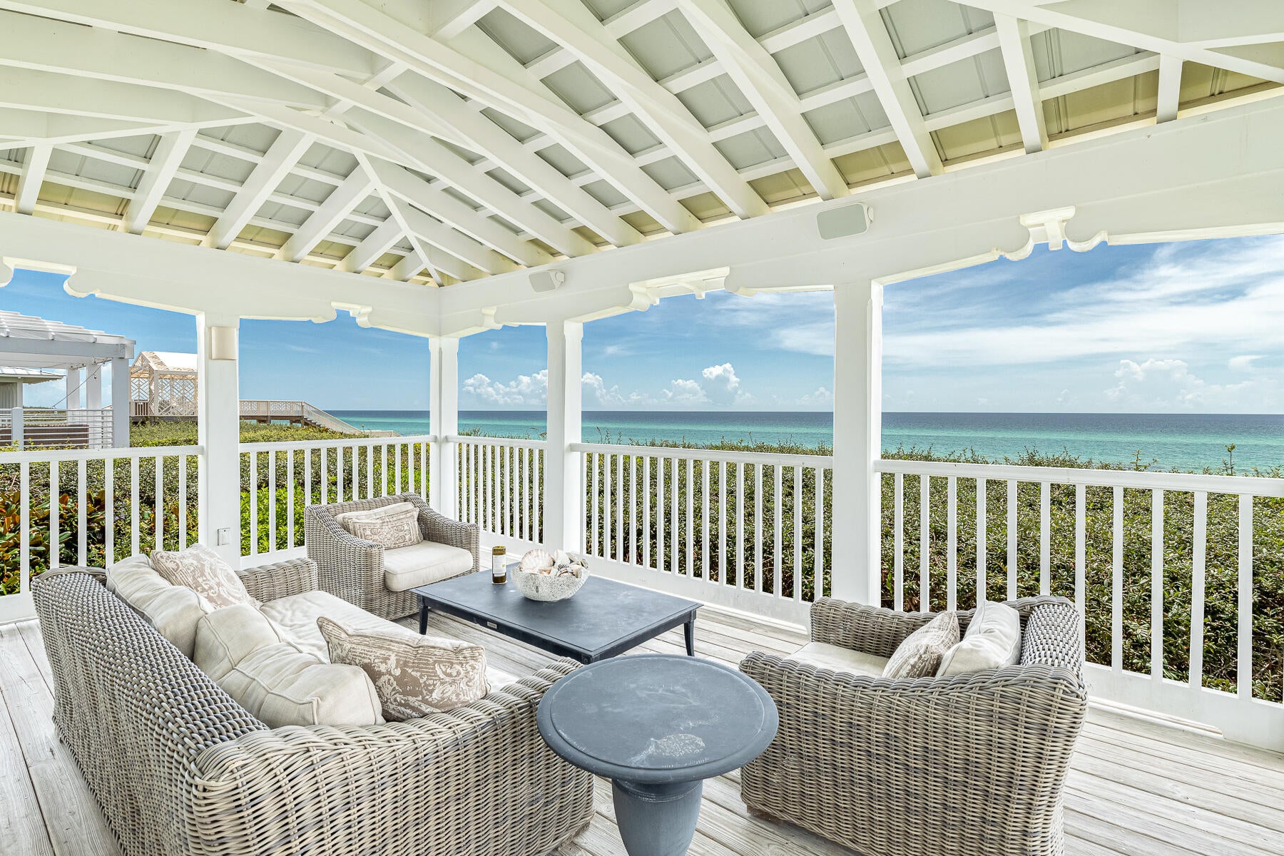 Gulf front and spectacular! The views from this incredible home will amaze you. This beauty was designed by renowned architect Scott Merrill, winner of AIA Design Awards, and the SEASIDE Prize.

Extensive remodeling throughout created this masterpiece! All emphasis is on the views and location. Brand new storm rated doors and windows frame the vistas and offer protection and peace of mind. The second level sports the kitchen with all high-end appliances, dining area, living room, and half bath. Wall to wall windows blur the lines between inside and out. Passing through one of the sets of French doors leads you to an open porch/outdoor living area overlooking the sea. This is the perfect place for catching early morning sunrises and those famous Gulf of America sunsets.

The ground floor boasts two gorgeous guest suites- one with four bunk beds, and a magnificent master suite! All bathrooms have been beautifully remodeled- new vanities, all newly tiled floors and showers, plus frameless glass shower doors, etc. Off the master suite is a separate and private screened porch with an oversized soaking tub- a peaceful and relaxing end to a busy beach day or just hiding from the kids!
The exterior of this classic beach cottage features board & batten siding, extended overhangs, full view glass doors and floor to ceiling windows. 

Seldom does a gorgeous gulf front home in SEASIDE- that's not a mini-hotel, become available for new ownership.  This is a must see and explore.