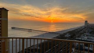 GOLDEN HOUR ELEVATED ~ From the 20th floor of Calypso Tower III, sweeping Gulf views and spectacular sunsets take center stage, with a front-row vantage point overlooking the Pier Park pier and seasonal fireworks lighting up the coastline. Step onto the oversized private balcony and you may quickly decide this is your favorite seat in Panama City Beach.

Located in one of PCB's most sought-after resort destinations, this beautifully appointed condo combines an exceptional beach lifestyle with strong short-term rental appeal. Just a five-minute walk from Pier Park and approximately 400 feet from deeded beach access, owners and guests can enjoy the Gulf, dining, shopping and entertainment without ever needing to get in the car.

Designed to comfortably accommodate six, the spacious floor plan includes a private king primary suite, custom-built hall bunks and a sleeper sofa, along with two full bathrooms, a feature that makes a noticeable difference when hosting family, friends or vacation guests.

Inside, thoughtful upgrades set this residence apart from the typical rental condo. Quartz countertops in the kitchen and baths, custom lighting, custom window treatments and wainscoting throughout create a polished coastal feel, while the open-concept kitchen with GE stainless steel appliances keeps the space comfortable and functional for everything from a quick beach-day breakfast to dinner after sunset.

 Offered fully furnished and turnkey, the condo is ready to enjoy personally or place into a rental program with no additional setup required. Completed in 2020, Tower III also offers the benefit of newer construction and modern systems compared with many established beachfront properties in the area.

Calypso Tower III delivers the resort experience buyers and vacationers are looking for, including a seasonally heated zero-entry pool, hot tub, fitness center, fire pit, tiki bars, rentable cabanas and on-site dining. And with Pier Park just steps away, Topgolf, the SkyWheel, movie theater, restaurants, shopping and family entertainment are all within easy reach.

Whether you are looking for a Gulf Coast getaway, an income-producing vacation property, or a little of both, this 20th-floor residence delivers a combination that is increasingly hard to duplicate, unforgettable views, a premier location and the ability to walk from your door to some of the best of Panama City Beach.

Coastal living meets sky-high serenity, where every sunset feels like your own private show.
