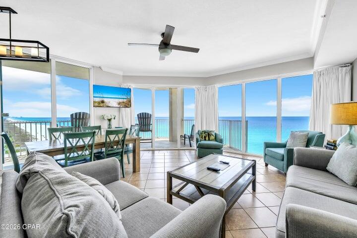 Welcome to one of the most sought-after offerings in Panama City Beach--Tidewater Beach Resort Unit 717. This rare east-facing corner residence showcases the highly desirable ''J'' floor plan, highlighted by an expansive wraparound balcony that truly sets it apart. Positioned at the ideal elevation, enjoy sweeping views of the emerald Gulf waters and sugar-white sand below. Inside, 9-foot ceilings and walls of glass fill the space with natural light, creating a bright, open living area designed to capture panoramic coastline views and unforgettable sunrises. Thoughtfully configured for both personal use and strong rental performance, the condo comfortably accommodates up to 10 guests.