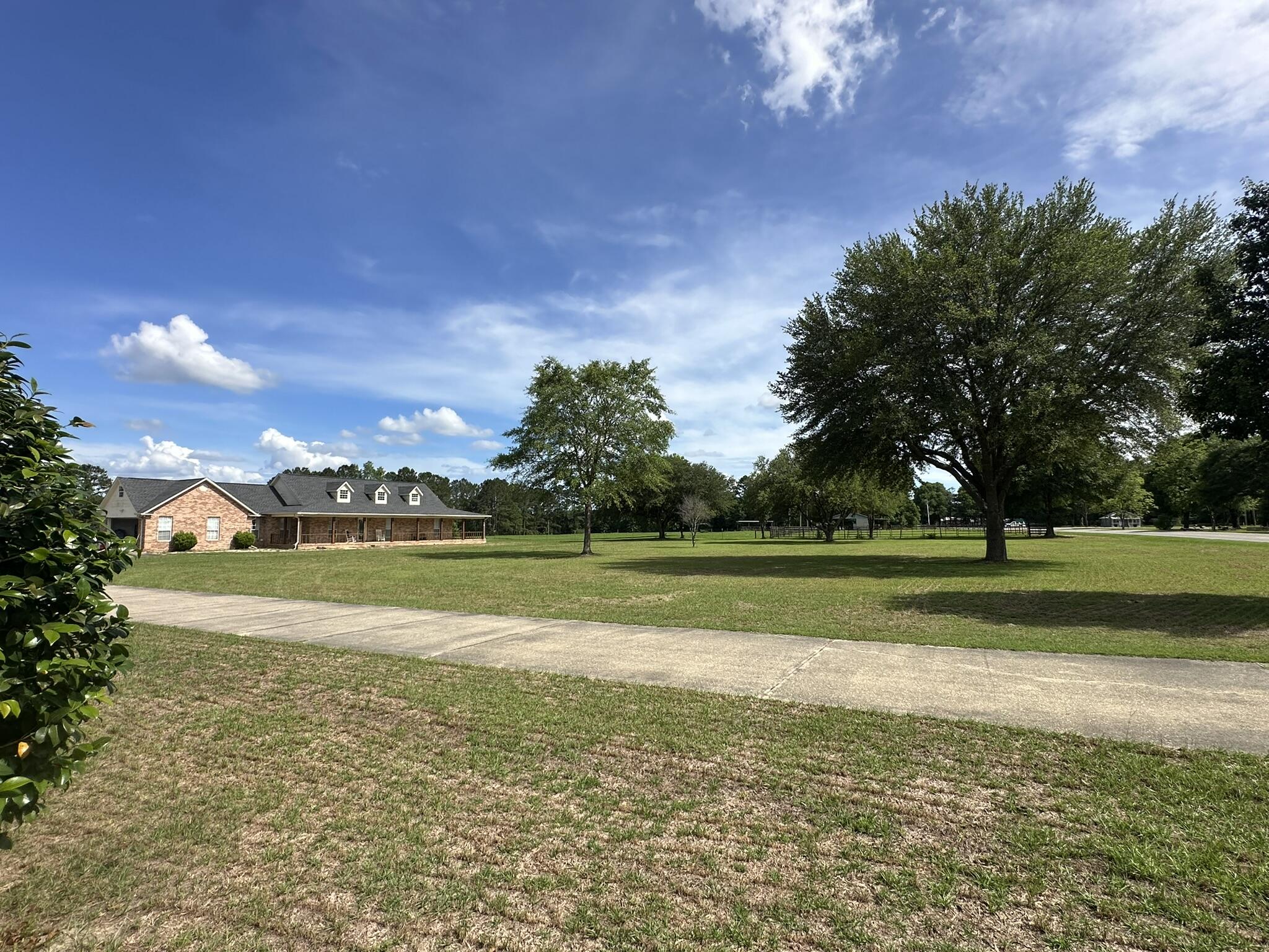 Shown by appointment only. Located in the Florala, Alabama area, this property features a single-family home set on a usable tract of land offering space, privacy, and flexibility in a rural setting. Florala is a small southern Alabama town known for its laid-back pace and access to outdoor recreation, including nearby Lake Jackson and surrounding natural areas. The property provides a quiet setting while still maintaining access to local conveniences, with Crestview, Florida, I-10, and regional destinations within a reasonable drive. The primary residence offers a welcoming layout with 3 bedrooms, 2 baths, an open living and kitchen design, oversized mudroom and laundry space, and spacious front and rear porches. A separate 3 bedroom, 2 bath cabin provides space for guests or weekend use, complete with its own entertainment area and fish cleaning station. Buyer and agent to verify and all information deemed important to purchase.