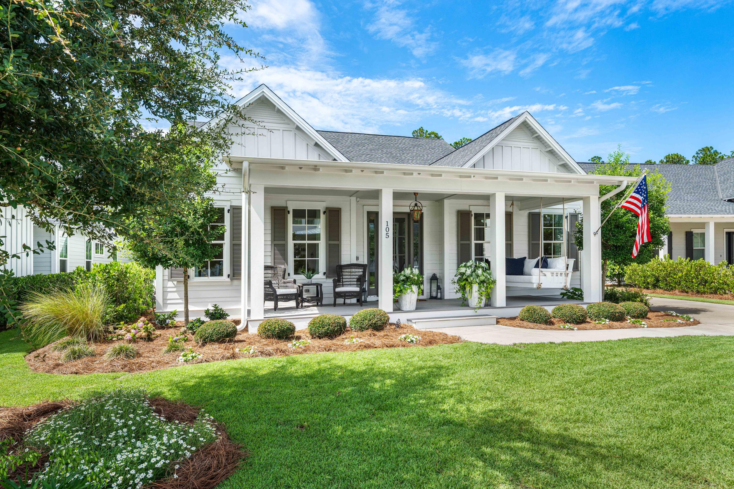 Welcome to 105 Rosecourt Street, the largest single-story floor plan in the highly sought-after Greenway phase of WaterSound Origins. Located on a quiet cul-de-sac with convenient access to Highway 98, this meticulously customized 4-bedroom, 3.5-bath coastal cottage offers the luxury of new construction without the wait. Featuring more than $300,000 in upgrades, the home showcases one of the finest outdoor living spaces in WaterSound Origins. The private backyard retreat includes a saltwater pool with dual waterfalls, an elevated spa with a SunBrite outdoor TV, a screened porch with a premium NatureKast outdoor kitchen, Big Green Egg, and Lynx gas grill. An expanded front porch with a custom hanging bed swing provides the perfect place to relax. Inside, thoughtful designer finishes include 10-foot ceilings, 8-foot solid-core doors, white oak ceiling details, grasscloth wall coverings, designer lighting, and custom millwork throughout. The open-concept living area centers around a chef's kitchen featuring Sub-Zero and KitchenAid appliances, a 10-foot quartz island, Carrara marble backsplash, custom wood hood, farmhouse sink, and built-in bar. The spacious primary suite is privately situated at the rear of the home and features a luxurious bath with dual vanities and a custom walk-in closet. Three additional bedrooms, including one with an en-suite bath and another currently serving as an office, provide flexible living space for family and guests. Additional highlights include a whole-home Sonos sound system with outdoor speakers and an in-ground subwoofer, a covered breezeway leading to the detached two-car garage, and an extended driveway for ample guest parking. Potentially a carriage house could be added above the detached garage. Offering exceptional craftsmanship, designer finishes, and unmatched indoor-outdoor living, 105 Rosecourt Street is a rare opportunity to own one of the most upgraded homes in WaterSound Origins.