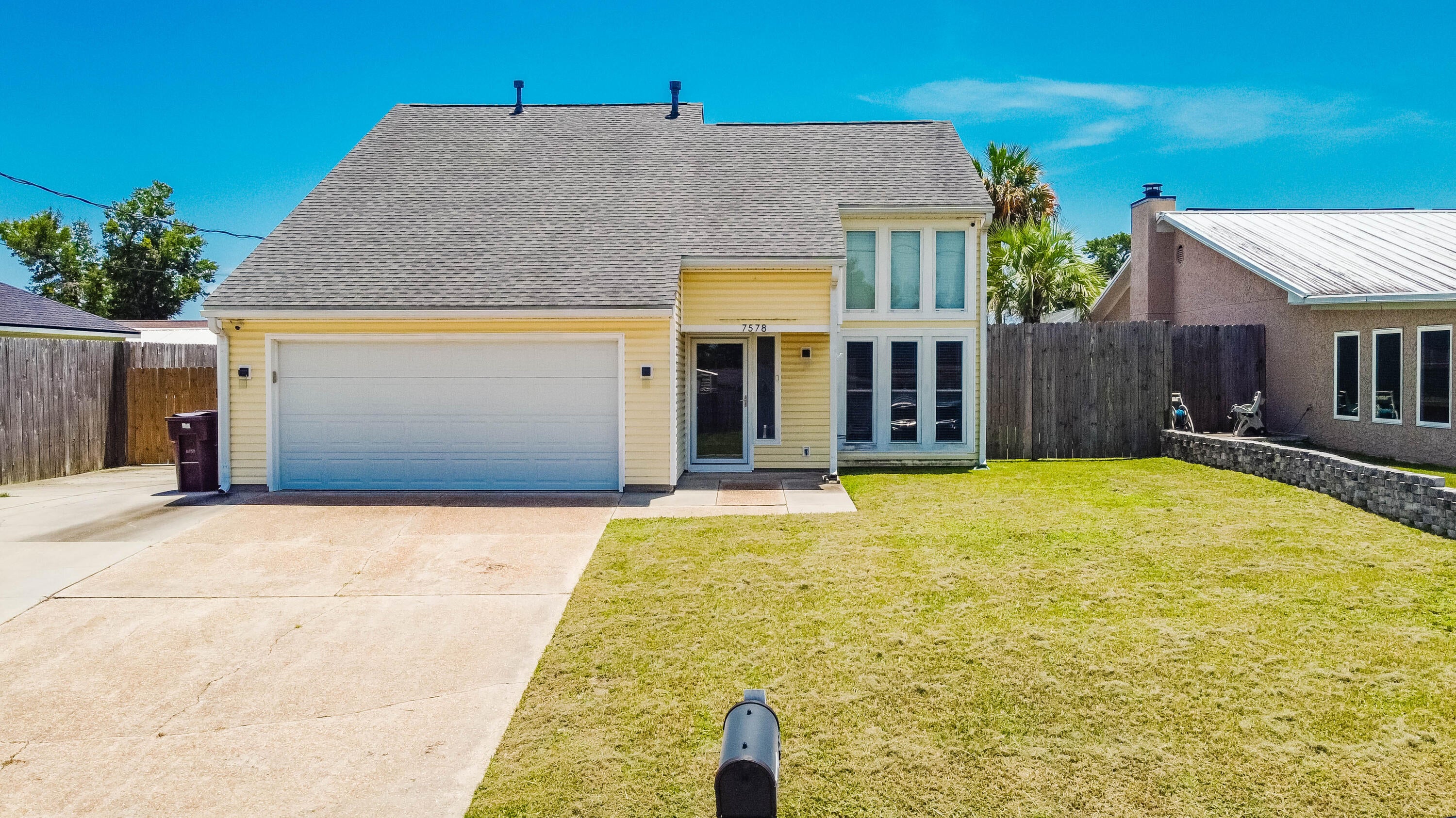 Come see this beautiful, two-story home with an air-conditioned yard building in Panama City! This 0.17 acre property showcases a fenced backyard area with a new gate, a large screened porch, additional driveway parking, and a spacious yard building with additional storage space & A/C that could be a workshop, craft room or cater to a variety of buyer's needs. The 1,766 sq ft home features tile flooring throughout, three bedrooms with two being on the second floor, a kitchen that includes stainless steel appliances, under cabinet lighting and abundant cabinet space, as well as a living space that features a high ceiling and lots of natural light from the floor to ceiling windows. The property is located within 2 miles of the Callaway Recreational Complex & Arts & Conference Center, as well as being within 3 miles of a Walmart Supercenter and additional shopping/restaurants off of US-98. The property is also located within 9 miles of Tyndall AFB and within 21 miles of Panama City Beach. Schedule your showing today!