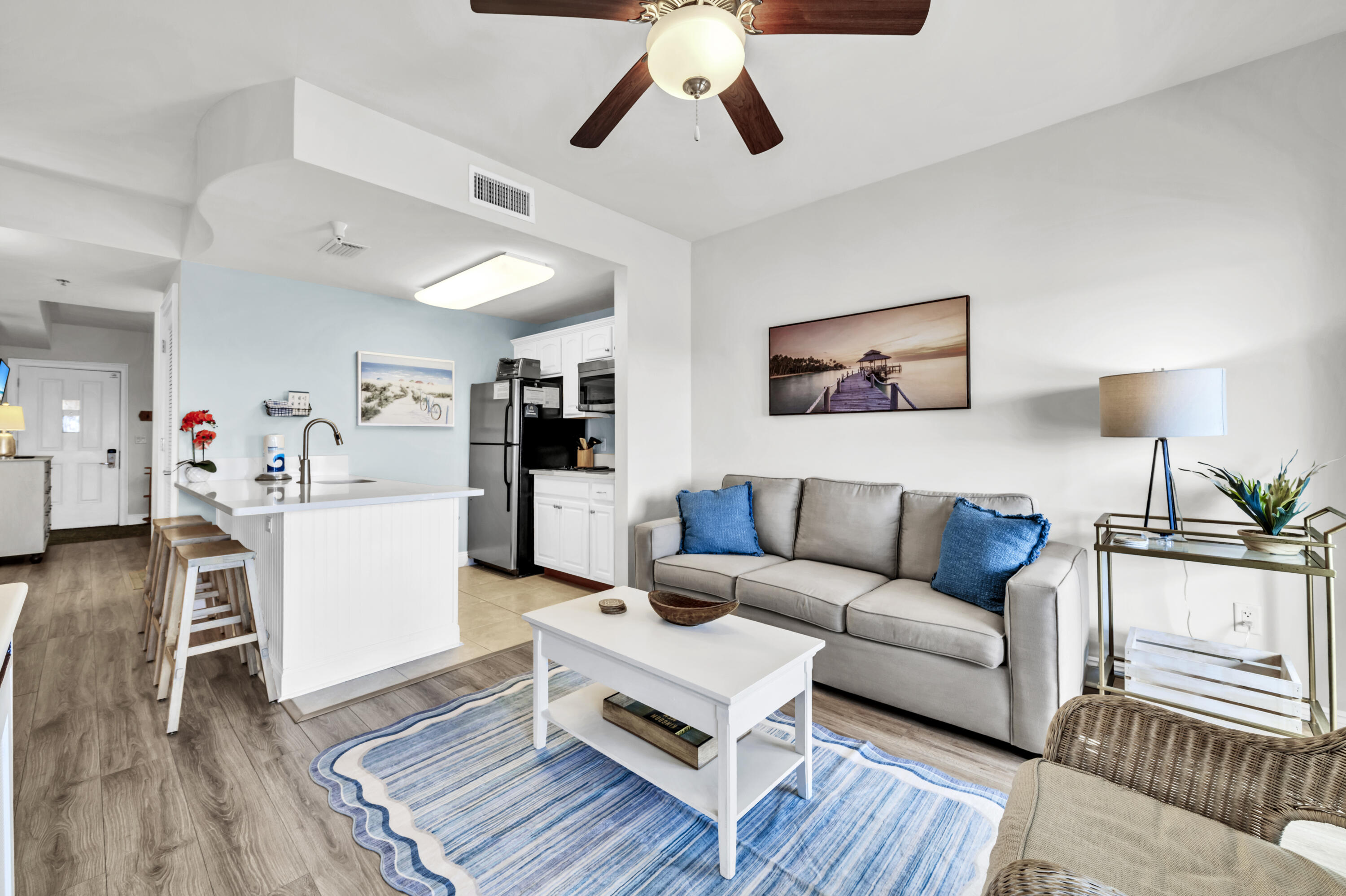 Updated 1 BR 1BA with breathtaking lake and Gulf views and resort style amenities. Enjoy the best of coastal living in this fully renovated 4th floor condo offering panoramic lake and Gulf views with unforgettable sunsets from your private balcony. The unit has been thoughtfully updated with luxury plank (LVP) flooring, elegant wainscoting, quartz countertops, a large upgraded sink, and newer furnishings, creating a fresh and modern beach retreat. Located in Carillon Beach Resort with resort style amenities, including: 4 swimming pools, one directly on the beach, tennis and basketball courts, new pickleball courts, playground, lush green spaces, paver stone walkways that are beautifully landscaped, 8 private deeded beach accesses with one mile of private beach,