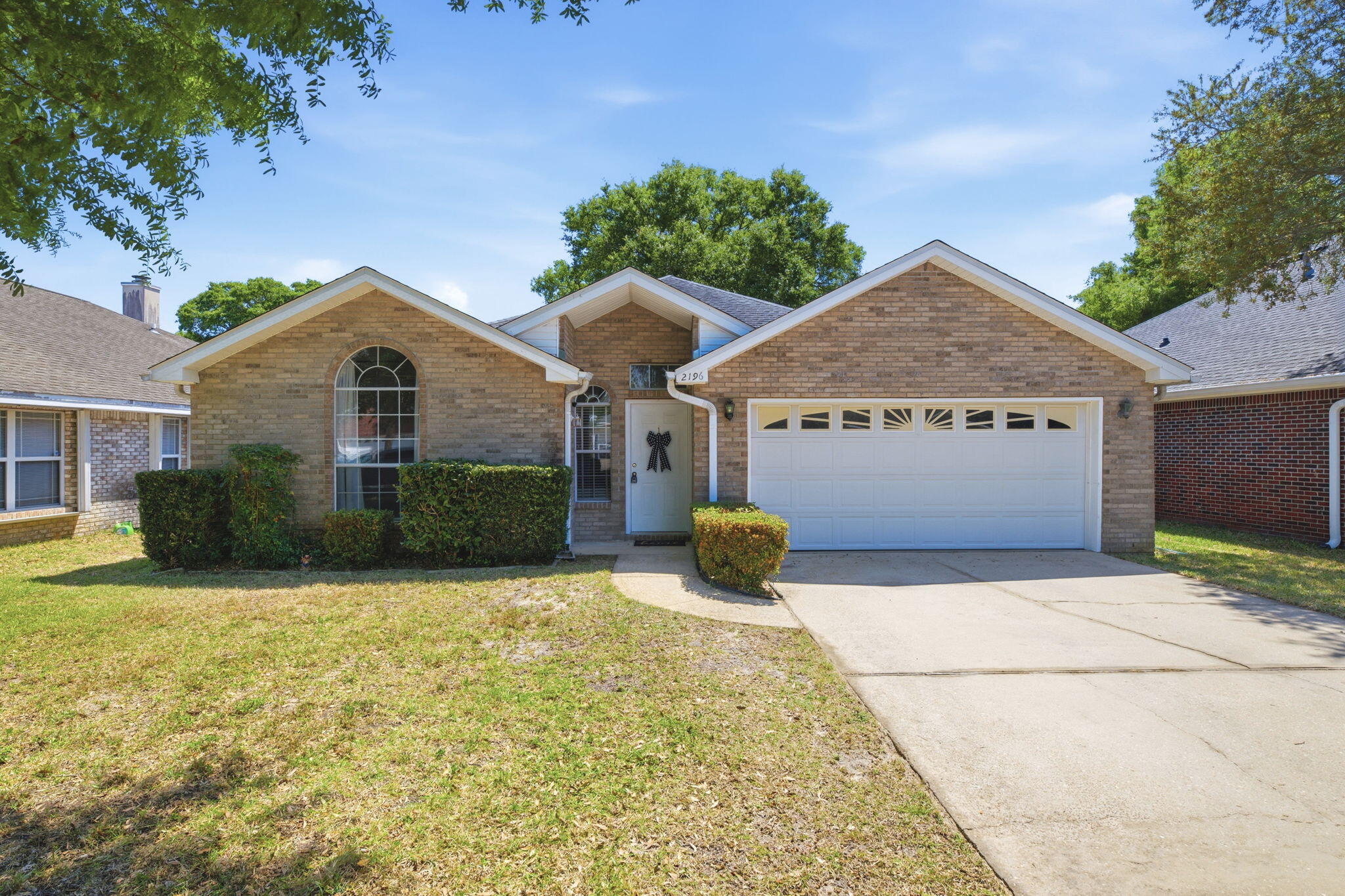 Your search stops here! This beautifully laid-out, all-brick, one-story home offers the perfect blend of comfort, functionality, and location, complete with a two-car garage. Step inside to a spacious living room with a cozy fireplace that flows into the dining area and kitchen. The layout feels open while still maintaining defined spaces. The kitchen offers ample cabinet storage, generous counter space, and a window over the sink for great natural light. The primary suite features a walk-in closet separate from the bathroom, which includes a soaking tub and walk-in shower. Two additional bedrooms and a guest bath are nearby. A separate laundry room sits just off the kitchen. Enjoy a fully fenced backyard and a quiet cul-de-sac location close to schools, bases, shopping, and dining!