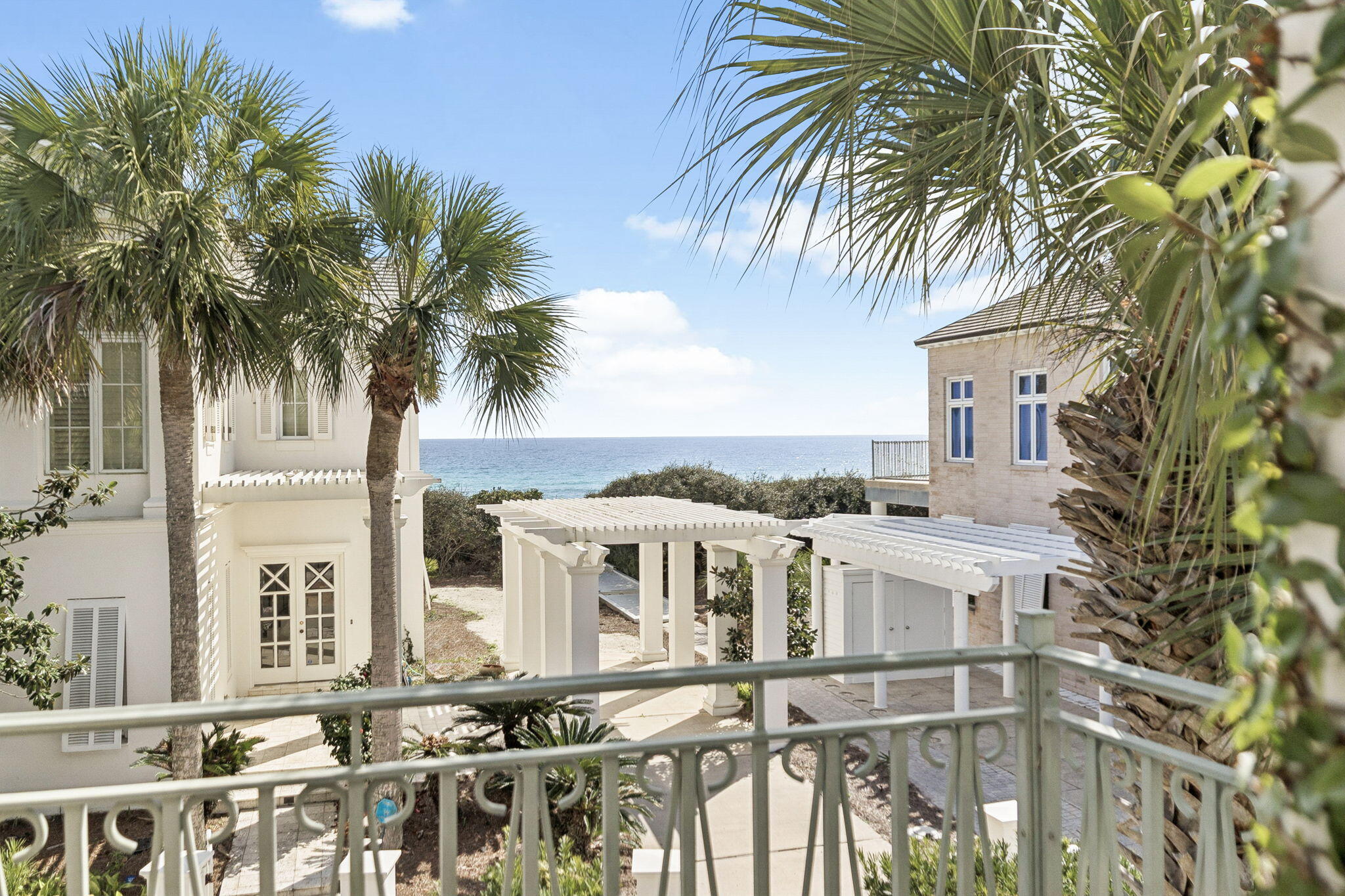 Discover refined coastal elegance in the exclusive, gated enclave of Jasmine Dunes, a secluded, rental-restricted community in Seagrove with 267 ft of private beach frontage, shared by just 14 Homesites. Positioned one tier back from the gulf and directly adjacent to the beach walkover, 65 Jasmine Circle delivers captivating gulf views from the living areas and expansive wraparound balcony. Wake to golden sunrises over emerald waters, enjoy dramatic sunsets, and relax to the soothing rhythm of the waves just steps away. This solidly built masonry home offers three bedrooms and 2,466 square feet of living space. The reverse layout includes a luxurious master suite with a Jacuzzi tub, separate shower, walk-in and built-in closets, and a private garden patio area on the first level, along with two guest bedrooms with a shared bathroom. Upstairs, enter the open-concept living area with soaring ceilings, abundant natural light, and a limestone fireplace. Two walls of glass doors and windows fill the space with light, and open to views of the gulf and the wraparound balcony.

The living room flows into the chef's kitchen with a gulf views; multiple islands; quartz countertops; and Bosch, Jenn-Air, and Sub-Zero appliances. Behind the kitchen is the butler pantry/office nook, half bath, and food serving corridor to the dining room. Soaring ceilings and large windows continue in the dining room, which could be repurposed as a second living room or TV room. A third-level reading loft with built-in bookshelves looks out over the main living room. Outside, multiple lush garden areas are located off the master suite patio, guest bedrooms, main entrance, and secondary parking trellis entrance. 

Jasmine Dunes residents enjoy exclusive amenities, including 267 ft of private beach frontage, two community pools, and an owner-reservable poolside guest house for visitors. Whether you're seeking a primary residence, second home, or legacy coastal retreat, 65 Jasmine Circle offers an unparalleled combination of location, views, and community exclusivity, where every day feels like a vacation.