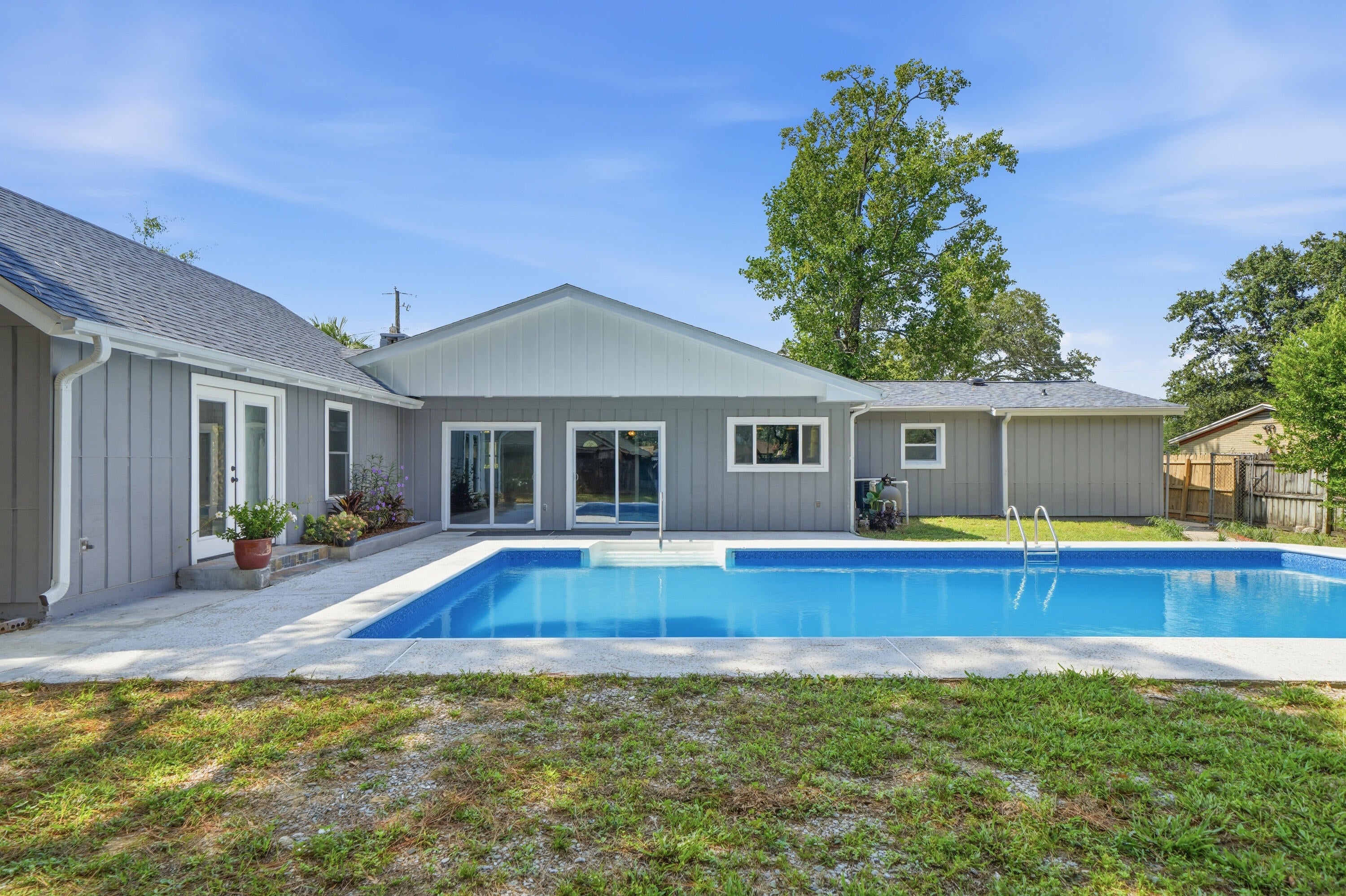 Beautifully renovated & spacious multigenerational property with an in-ground POOL near beaches, bases, & boat launches! This unique home is nestled on a .31/acre lot with NO HOA and offers the perfect amount of space in every room to enjoy & entertain! The large backyard provides ample space beyond the lined pool! If you are needing space and/or a separate living area for guests, then look no further! The guest quarters/mother-in-law suite is perfect for having friends/family live-in with you while having their separate quarters with a bedroom, closet, full bathroom, kitchenette, living/dining area, and it's own entry/exit to the front of the home/driveway! This home has been recently & extensively renovated throughout and features 5 bedrooms, 3 full bathrooms, and has 2,655 sq. ft. The main house features a living room, a den with a wood burning fireplace, a huge kitchen that is open to a large dining space, 3 guest bedrooms, a full guest bathroom, a primary bedroom with a gorgeous bathroom, walk-in-closet, and sliding door access from the primary bedroom to the side of the home where there is an outdoor shower and access to the backyard/pool. This sure makes it easy to let out pets at night or to come inside from taking a dip in the pool! Other BRAND NEW OR LESS THAN 2 YEAR OLD ITEMS throughout are the following: 2024 roof, gas tankless water heater, HVAC, electrical panel, windows, interior and exterior doors, added recessedlighting, all lighting fixtures & ceiling fans, electrical panel, windows, doors, added recessed lighting, LVP and tile flooring, quartz kitchen countertops, kitchen backsplash, kitchen appliances, bathroom vanities & mirrors, showers, toilets, paint inside & outside, pool liner, & more! This home offers new home vibes and is a MUST SEE in person! Check out the virtual tour and the video of this home and then shedule your private showing today! 
*Distance from 390 Davenport Avenue to popular locations: 
1.) 2.5 miles to Eglin Air Force Base - back gate
2.) 6.5 miles to Eglin Air Force Base - main gate
3.) 12.4 miles to Duke Field AF Base
4.) 13.2 miles to Hurlburt - back gate
5.) 16.5 miles to Hurlburt - main gate
6.) 16 miles to Army 7th Group Special Forces 
7.) 9.5 miles to Naval Explosive Ordnance Disposal 
8.) 2.4 miles to Lewis School (elementary)
9.) 2.4 miles to Lewis School (middle)
10.) 3.7 miles to Okaloosa STEMM Academy (middle)
11.) 2.3 miles to Niceville High School
12.) 3.5 miles to Rocky Bayou Christian School (elementary-high school)
13.) 4 miles to Publix
14.) 3.4 miles to Walmart
15.) 1.9 miles to Lincoln Park (playground, bay access, and public boat launch)
16.) 2.4 miles to Lions Park (picnics, bay access, and public boat launch)
17.) Destin beaches (Crystal Beach - 14.5 miles) (Henderson Beach State Park - 15.5 miles)
18.) Fort Walton Beach beaches (The Boardwalk - 13 miles) (Beasley State Park - 13.5 miles) 
19.) 0.4 miles to Tradewinds Italian Restaurant
20.) 0.5 miles to Basil & Baxter's Kitchen and Cocktails
21.) 1 mile to The Boat House Landing (restaurant)
22.) 1.6 miles to Doc's Oyster Bar (restaurant)