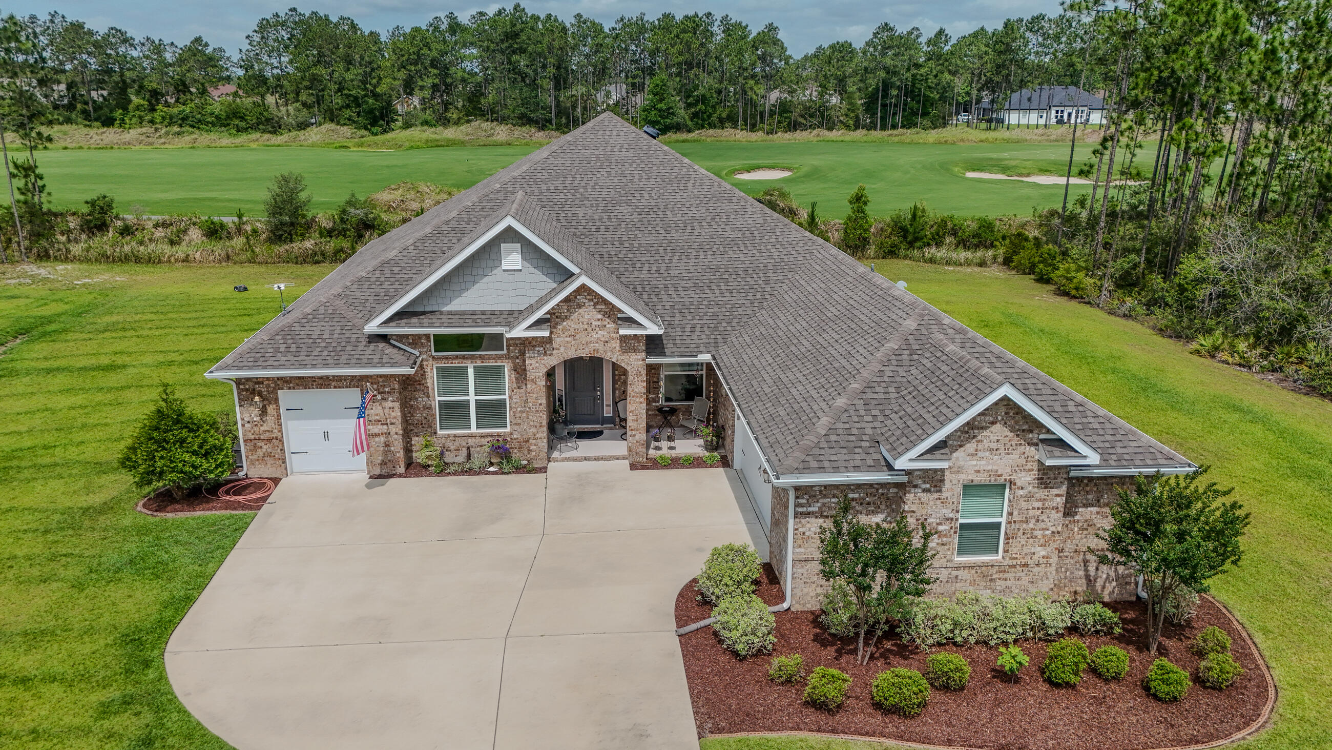 Discover this immaculate, like-new 3,058 sq ft ranch-style residence nestled along the 13th fairway of the esteemed Windswept Dunes Golf Course. Located within the gated Windswept Estates community, this elegant 4-bedroom, 3-bath home offers luxury, privacy, and peaceful views--just 25 minutes from the renowned white-sand beaches of the Emerald Coast. Step inside to soaring 12-foot ceilings and an open, airy layout designed for both upscale entertaining and everyday comfort. Freshly painted throughout in 2024--including walls, trim, and doors--this home is truly move-in ready. The gourmet kitchen is a chef's dream, featuring a sprawling quartz island perfect for gatherings, meal prep, or casual dining. A breakfast nook, formal dining room, walk-in pantry, and built-in coffee bar and beverage station complete the entertainer's layout. A standout feature is the oversized butler's pantry/laundry room, complete with custom cabinetry, granite countertops, a deep sink, and designer tile backsplash blending style with functionality. Smart home conveniences include LED lighting, a Ring video doorbell, Wi-Fi-enabled front door lock, and smart electric garage doors. The expansive 2.5-car garage offers ample storage, while the separate golf cart garage features a built-in workshop. Relax on your screened-in back porch while enjoying tranquil sunsets and golf course views.