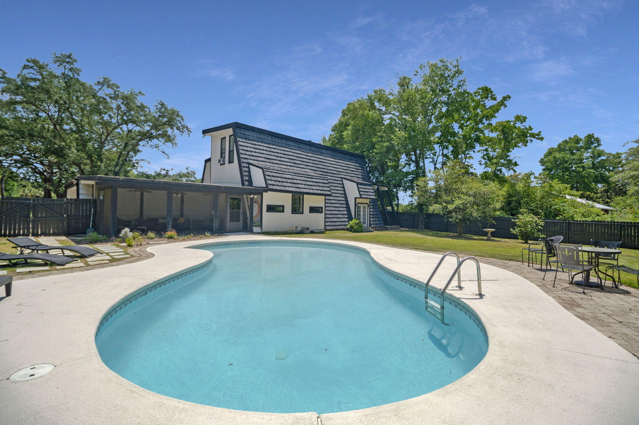 Short Term Rental Capability!
Rarely does a property offer this combination of scale, luxury, and location. Set on over an acre of lush, private land just minutes from the sugar-white sands of Navarre Beach, this stunning three-level home delivers nearly 4,000 square feet of thoughtfully designed living space.
Three expansive levels provide the space and flexibility that families, entertainers, and savvy investors dream of - with room for everyone to spread out and unwind. The chef's kitchen is the heart of the home, outfitted for serious cooking, effortless entertaining, and generous workspace.
Step outside and discover your own private resort. A large patio sets the stage for al fresco dining, sunset gatherings, and leisurely afternoons centered around a beautiful pool enclosed by lush, mature landscaping. The fully fenced backyard delivers serious privacy and tranquility.
Location is everything, and this property delivers. Navarre Beach -- consistently ranked among Florida's most beautiful and uncrowded stretches of coastline -- is just minutes away, putting world-class sand and emerald water at your fingertips.
This home has been utilized as an income-generating STR previously, and is ready to keep produce revenue from day one. 
Whether you're seeking a smart investment, a forever home, or the perfect blend of both, this is a rare opportunity on the Emerald Coast.