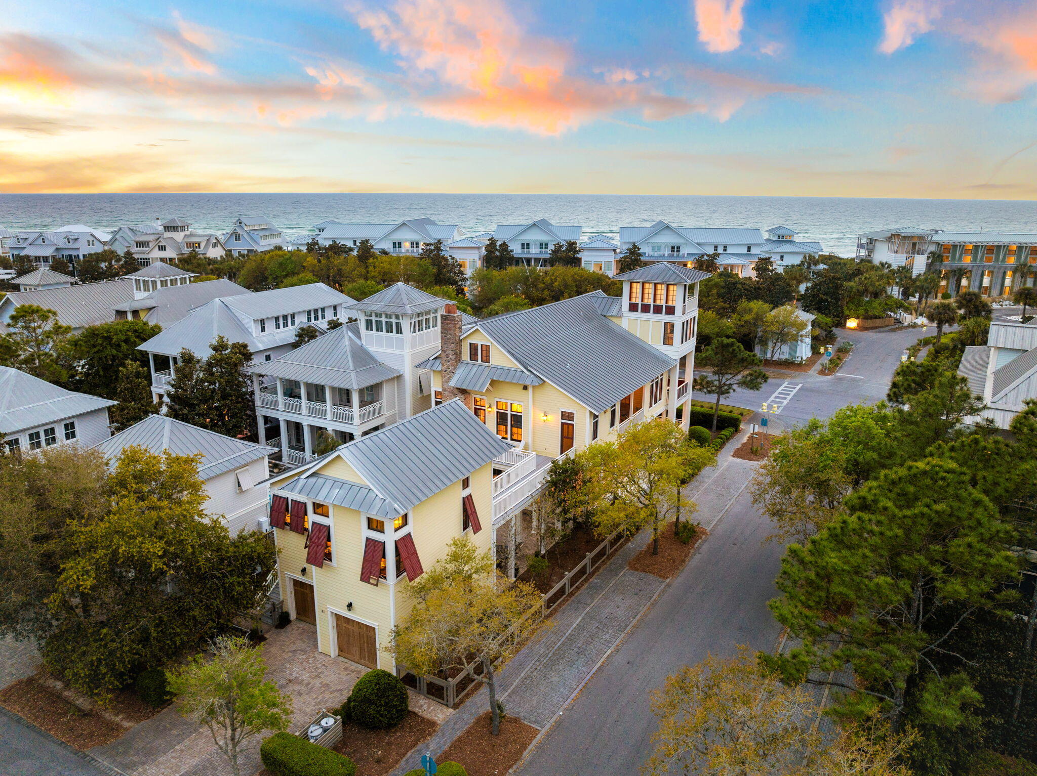 Located in the heart of WaterColor, this corner-lot residence offers multiple porches with Gulf views from its four-story watchtower. Positioned across from the WaterColor Beach Club and just down from Seaside, the home spans more than 5,000 sq ft and includes seven bedrooms, a private pool, and a carriage house. Recent updates feature an additional third-floor bathroom, refreshed flooring, and upgraded lighting. Additional details include a central vacuum system and floor-to-ceiling impact glass windows.

The main living and dining areas are located on the second floor, providing privacy and abundant natural light. The living room features soaring ceilings and French doors that open to generous covered outdoor spaces, creating seamless indoor-outdoor flow.

WaterColor, Florida, is one of 30A's most sought-after communities. Miles of walking and biking trails wind through lush coastal forests, connecting neighborhoods to parks, pools, Western Lake, the Town Center, and the beach. Enjoy multiple community pools, including the expansive Camp WaterColor and the iconic WaterColor Beach Club with Gulf views and beach access. Western Lake and the BoatHouse provide opportunities for kayaking, paddleboarding, and enjoying the area's breathtaking natural surroundings. Beautiful gathering spaces such as Cerulean Park, Marina Park, and Western Lake Park create peaceful place A formal dining area and additional sitting spaces offer flexibility, while the kitchen is equipped with premium appliances, ample cabinetry, and a bar seating area.

Accommodations include suites on each floor and in the carriage house, along with a built-in bunk area. The private pool is positioned between the main house and carriage house, complemented by a wood-burning fireplace and outdoor kitchen. A spacious mudroom includes custom built-ins, two sets of washers and dryers, and a changing room for convenient pool and beach access.

WaterColor offers a wide range of amenities, including a beach club, fitness center, town center, tennis and pickleball courts, walking and biking trails, and a boathouse with access to the lake for paddle boarding and kayaking. The community is also conveniently located just minutes from the dining and entertainment options along Scenic 30A. Inquire today to schedule a private showing and experience all that WaterColor has to offer.