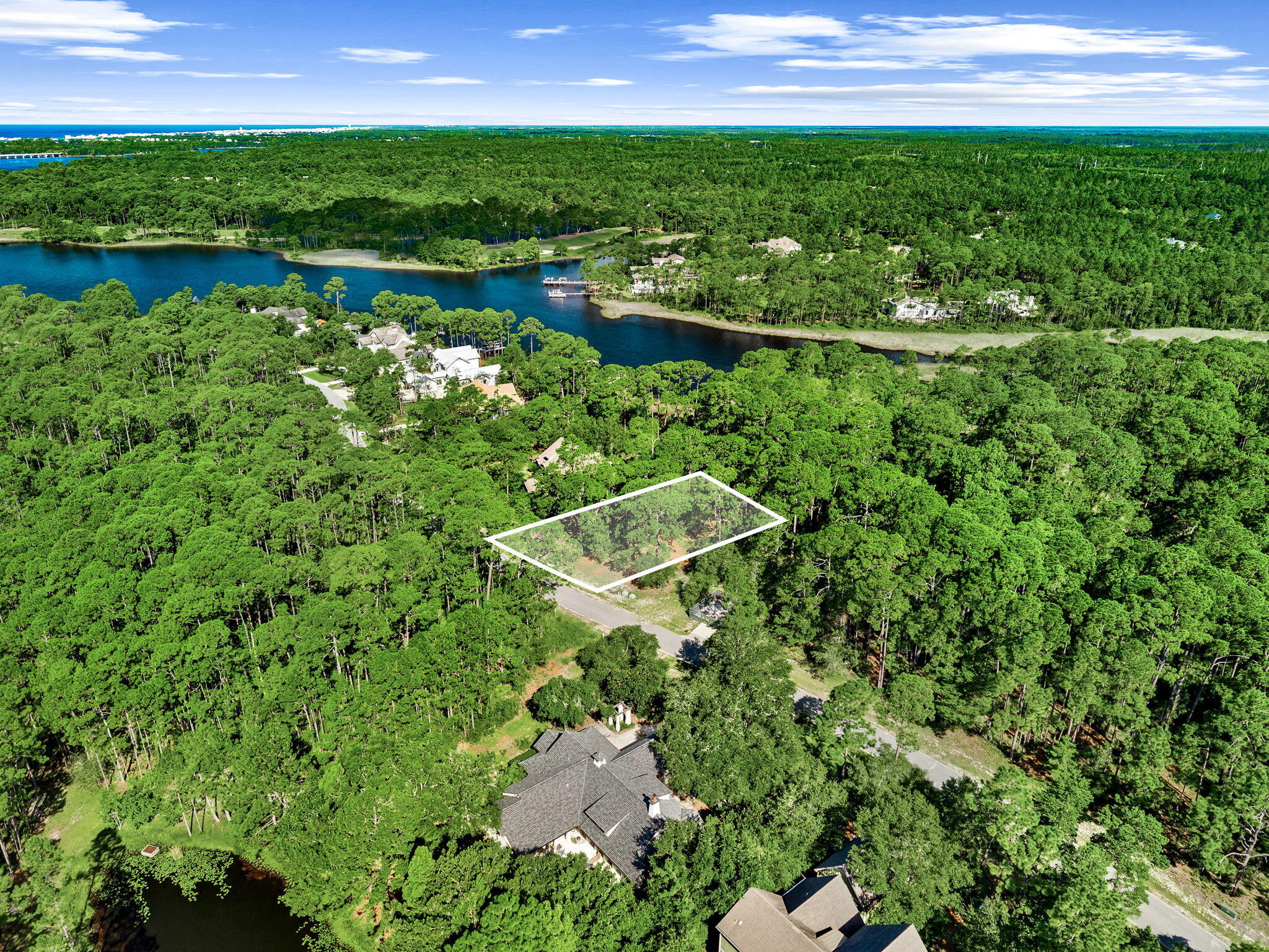Build your dream home in the beautiful gated community of Wild Heron. Located at 22110 Marsh Rabbit Run, this spacious wooded homesite offers a peaceful setting surrounded by mature pines and the natural beauty that makes Wild Heron so special. With its generous size and established surroundings, the property provides an ideal canvas for a custom home designed to take advantage of the privacy and serene setting.

Wild Heron is nestled along the shores of Lake Powell, Florida's largest coastal dune lake, offering residents a unique combination of nature, recreation, and coastal living. Community amenities include a lakeside swimming pool, fitness center, community dock, scenic walking and biking trails, playground, and beautifully preserved natural areas throughout the neighborhood. Wild Heron is also home to the private Shark's Tooth Golf Club.

Enjoy the tranquility of a gated community while remaining just a short drive from the sugar-white beaches of the Gulf, Scenic Highway 30A, Pier Park, dining, shopping, and everything Panama City Beach has to offer. 22110 Marsh Rabbit Run is an exceptional opportunity to create a custom home in one of Northwest Florida's most distinctive communities.