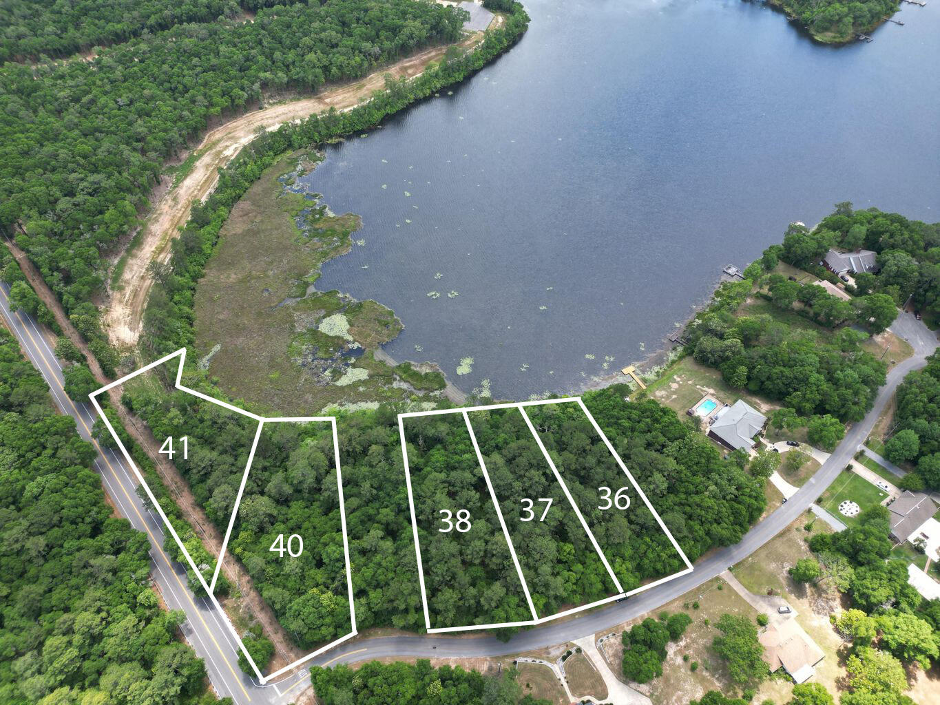 Nestled along the serene shores of Lake Holley Circle awaits a rare opportunity to embrace lakeside living at its finest. Welcome to this captivating lakefront property boasting over 67 feet of water frontage and spanning approximately 0.68+/- acres of picturesque landscape.

As you arrive, you'll be greeted by the tranquil ambiance of the lake, inviting you to unwind and immerse yourself in nature's beauty. The property offers a prime location for building your dream retreat, where every morning begins with breathtaking sunrise views dancing across the water.