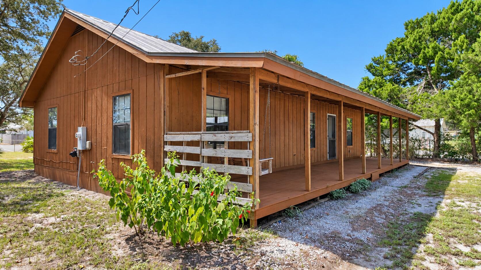 Located in South Walton County, 40 Country Club Dr is an ''Old Florida'' cottage-style home in the unrecorded subdivision of Country Club Estates on an 80' x 145' (0.26-acre) lot.
Lot 3, Block A offers a 3BR/2BA, 1,288 Sq Ft home built in 1992 with approximately $2,350/month long-term rental potential. 
Classic wood-paneled walls and freshly-painted concrete floors adds to this cottage's character. The 44ft-wide front porch gives real curb appeal and plenty of space for outdoor relaxation - or evening listening to the singing whippoorwills and the croaking tree frogs. The backyard provides room for future expansion -- a swimming pool or workshop, and plenty of space for gardening.
South Walton / Scenic 30A Location
County Hwy 393 provides a convenient Beach-to-Bay connection between Scenic Hwy 30A and the Gulf, and also Hogtown Bayou and Choctawhatchee Bay. The property is approximately 1/2 mile from Gulf Place and Ed Walline Regional Beach Access, where you can enjoy amazing seasonal sunsets and sunrises. Several additional public beach accesses are nearby.
South Walton's unique coastal dune lakes, Grayton Beach State Park and a wide selection of restaurants, shopping and recreation add to the appeal of this location. Just north on 393, Cessna Landing provides a public boat launch, recreational amenities and parking.
With no HOA, keep your boat or RV right on your own property. Short-term rentals are allowed. This section of 393 is golf-cart friendly with a nearby pedestrian/bike path.