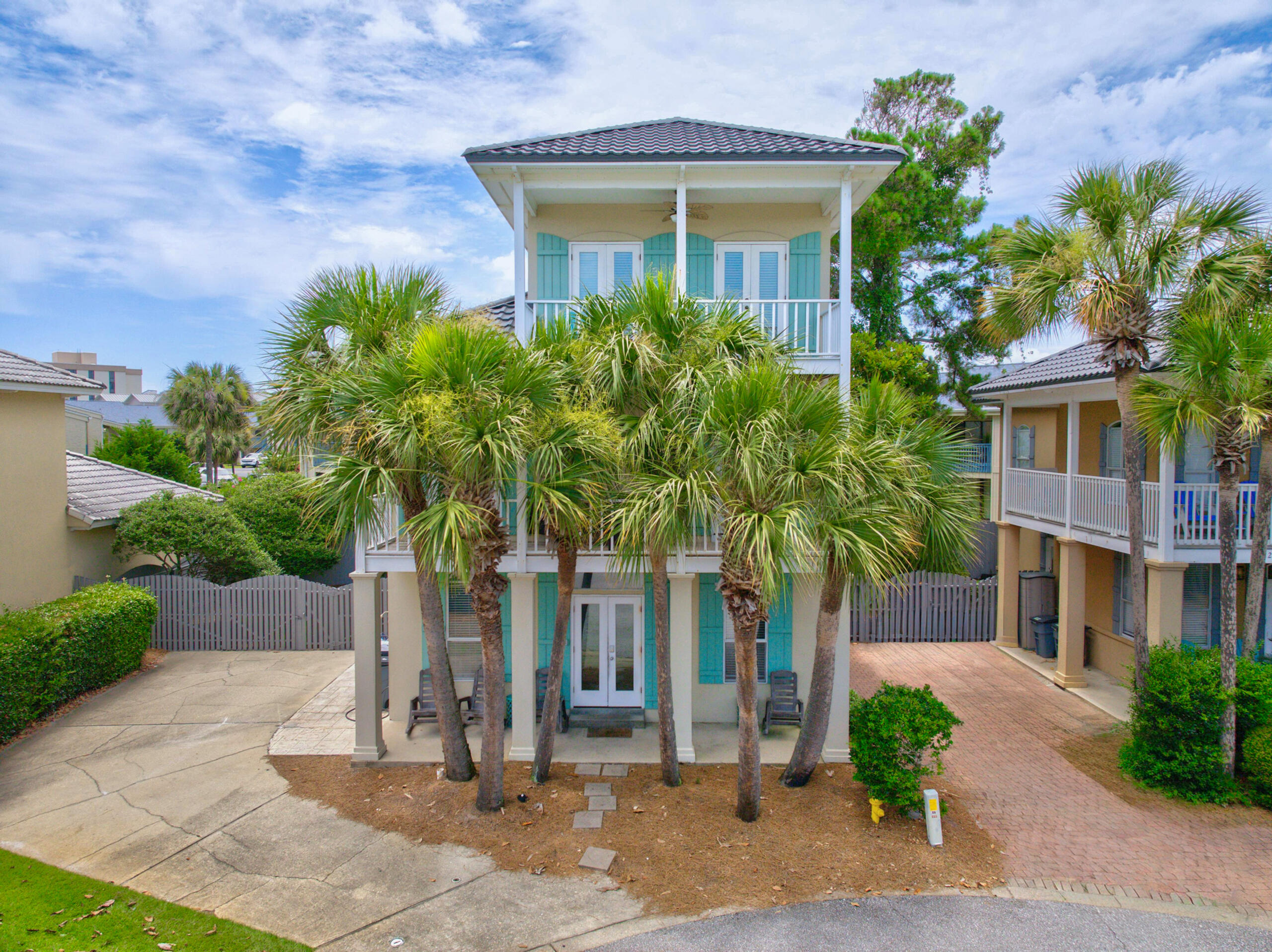 Discover coastal living just steps from the sugar-white sands of the Emerald Coast in this updated 3-bedroom, 2-bath beach house featuring a versatile third-floor loft in the gated community of Emerald Shores. Positioned approximately 300 yards from private beach access and adjacent to a community pool, this home offers an ideal layout for a primary retreat, second home, or turnkey investment property.  The ground floor features an open-concept living and dining area with low-maintenance tile flooring, a well-appointed kitchen, and a main-level primary suite. Upstairs, two secondary bedrooms feature French doors leading to an expansive outdoor balcony. The top-floor loft offers flexible space for additional accommodations, a media room, or a home office. Offered fully furnished and rental-ready, residents and guests enjoy exclusive access to two community pools, tennis and pickleball courts, and the private Emerald Shores beach pavilion with controlled Gulf access.