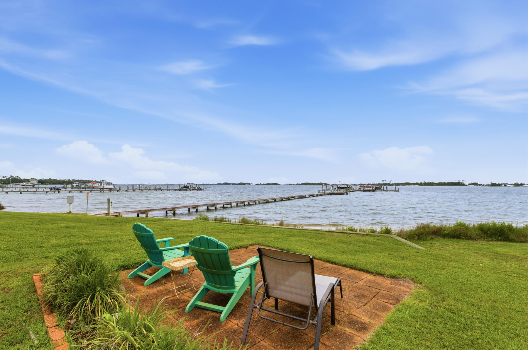 Stunning coastal living with one of the best views in the building. This third floor residence lets you enjoy breathtaking WATERFRONT VIEWS FROM NEARLY EVERY ROOM, DIRECTLY OF THE SANTA ROSA SOUND, with expansive windows showcasing the beautiful scenery.  NEW VINYL FLOORING INSTALLED AND FRESHLY PAINTED - offering a fresh, modern aesthetic. Charming- well-maintained kitchen with classic wood cabinetry, ample counter space, and functional layout. The living area, providing stunning, panoramic waterfront views, offers a calm and coastal setting, with generous space. The primary bedroom designed for comfortability, ensures a sizeable closet, and sliding glass doors that open to your perfect waterfront view. The additional two bedrooms that are equally versatile, continue the homes atmosphere with spacious comfort, overlooking the channel. The outdoor/backyard space brings a sense of tranquility, making it a standout feature for this beautiful condo, offering peaceful views from your personal balcony. With the perfect location of this condo, just beyond your backyard, waterfront living has never felt closer.