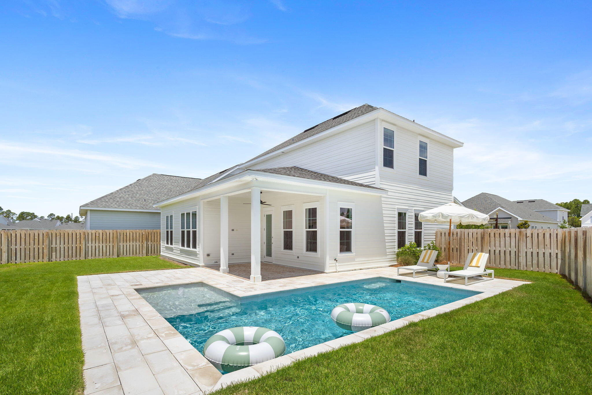 Oversized, corner lot, four bedroom four bathroom home with custom private pool in Watersound Origins. The home has all the right finishes, extra-privacy fence, upgraded tile upstairs and downstairs, custom kitchen vent hood and first floor fireplace. Longleaf homes are easy-in, easy-out access to Origins with the best proximity to Publix, restaurants and neighborhood amenities. The future growth of Origins is heading west, Longleaf is the entry point easily the best value in the neighborhood. This home is adjacent to the mailbox and a huge HOA-maintained green space. All appliances, washer, dryer, and window treatments pictured are included. There are no equivalent Longleaf lots available or coming available for sale. Home layout is included in listing photos, seller will include furniture pictured at full price.
