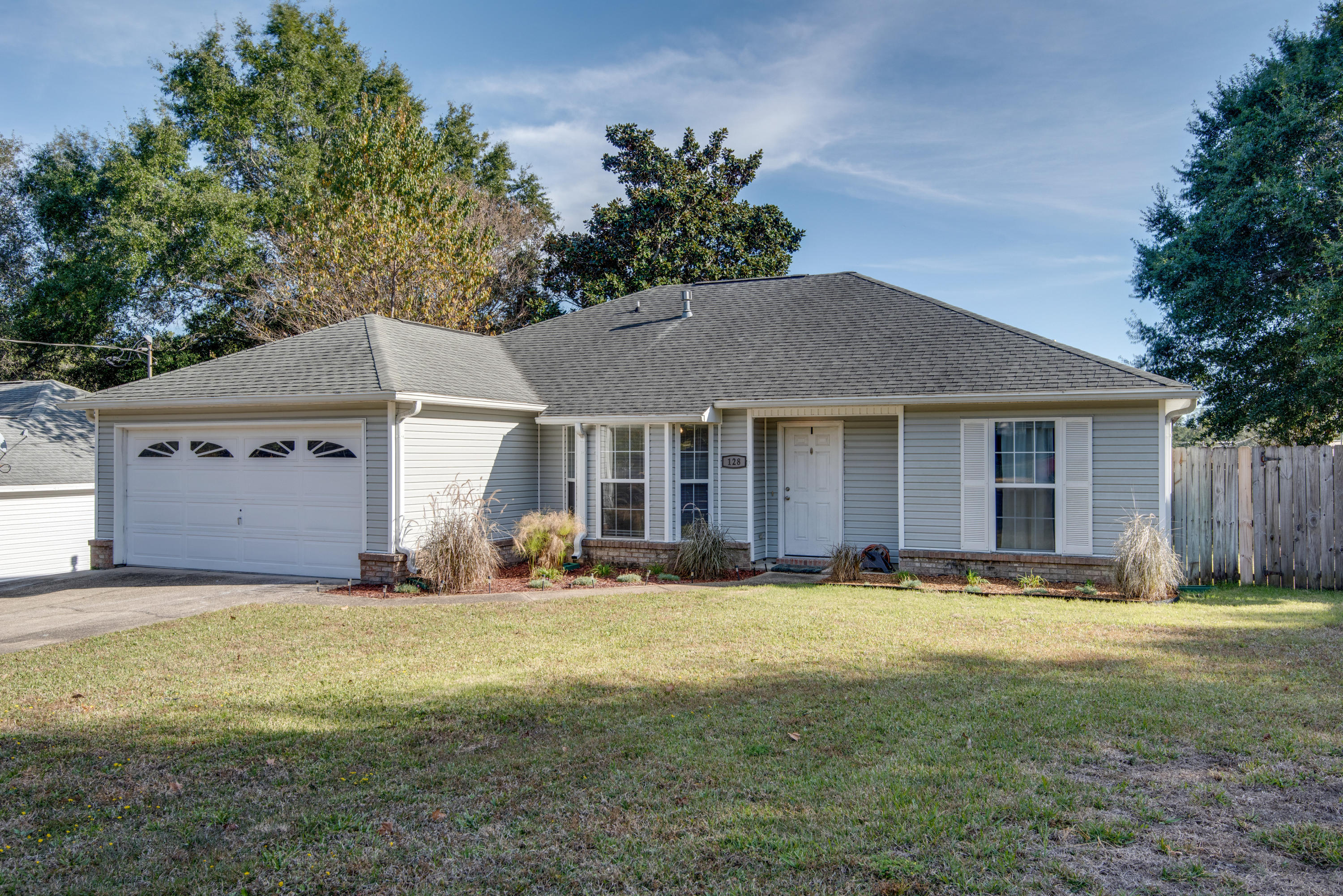 Bring the Boat or RV, and the Dogs--This 4 Bedroom's Got Space for It! Welcome to 128 Menzel--where your commute can be shorter than your coffee order! Located less than a mile from Eglin's East Gate and just minutes from Duke Field and Special Forces, you can spend less time in traffic and more time doing literally anything else you'd rather be doing.

Need a beach fix, shopping adventure, or a reason to justify buying one more thing at Target? Destin is just a quick drive away with all the dining, shopping, and sugar-white sand your heart can handle.

This charming 1,608 SF home offers a smart 4-bedroom, 2-bath split floor plan with room for everyone--including that one person who insists they 'need a home office.' As you step inside, the front bedroom to the left is perfectly suited for an office, guest room, hobby space, or your future 'I'm going to get organized this year' room. 

Straight ahead you'll find a spacious living area featuring soaring cathedral ceilings, beautiful wood-look tile flooring, and a decorative stone gas fireplace that practically says, 'Go ahead, put on comfy clothes and stay awhile.'

To the left of the living room is an inviting eat-in kitchen complete with updated cabinetry, subway tile backsplash, granite countertops, and stainless appliances--because cereal somehow tastes more sophisticated when surrounded by granite.

Just off the living room, you'll discover a covered lanai ideal for morning coffee, evening unwinding, or quietly pretending you can't hear your phone ringing.

Tucked beyond the kitchen are the indoor laundry room and spacious primary suite. The primary bath features double vanities (because sharing sink space builds character, but who wants that?), a separate shower, and a whirlpool tub perfect for relaxing after a long day.

The additional bedrooms and guest bath are thoughtfully positioned on the opposite side of the home, giving everyone a little breathing room.

Outside, the fully fenced backyard offers privacy and functionality with a double gate and concrete parking pad large enough for your boat, RV, trailer, or collection of hobbies you swear you'll use every weekend.

This lovely home has a lot to offer and even welcomes up to two pets with some restrictions--because home is better when someone is excited you walked through the door.

Call 850-729-0399 View rental requirements or apply at www.RentwithBSR.com

No smoking or vaping. Pets may be allowed with some restrictions and a $400 non-refundable pet fee. FEES: $50 per adult 18+ application fee, Landlord Liability Policy (if proof of Renter's coverage is not provided) $15 mo, Pest Assurance pest control policy $20 mo.