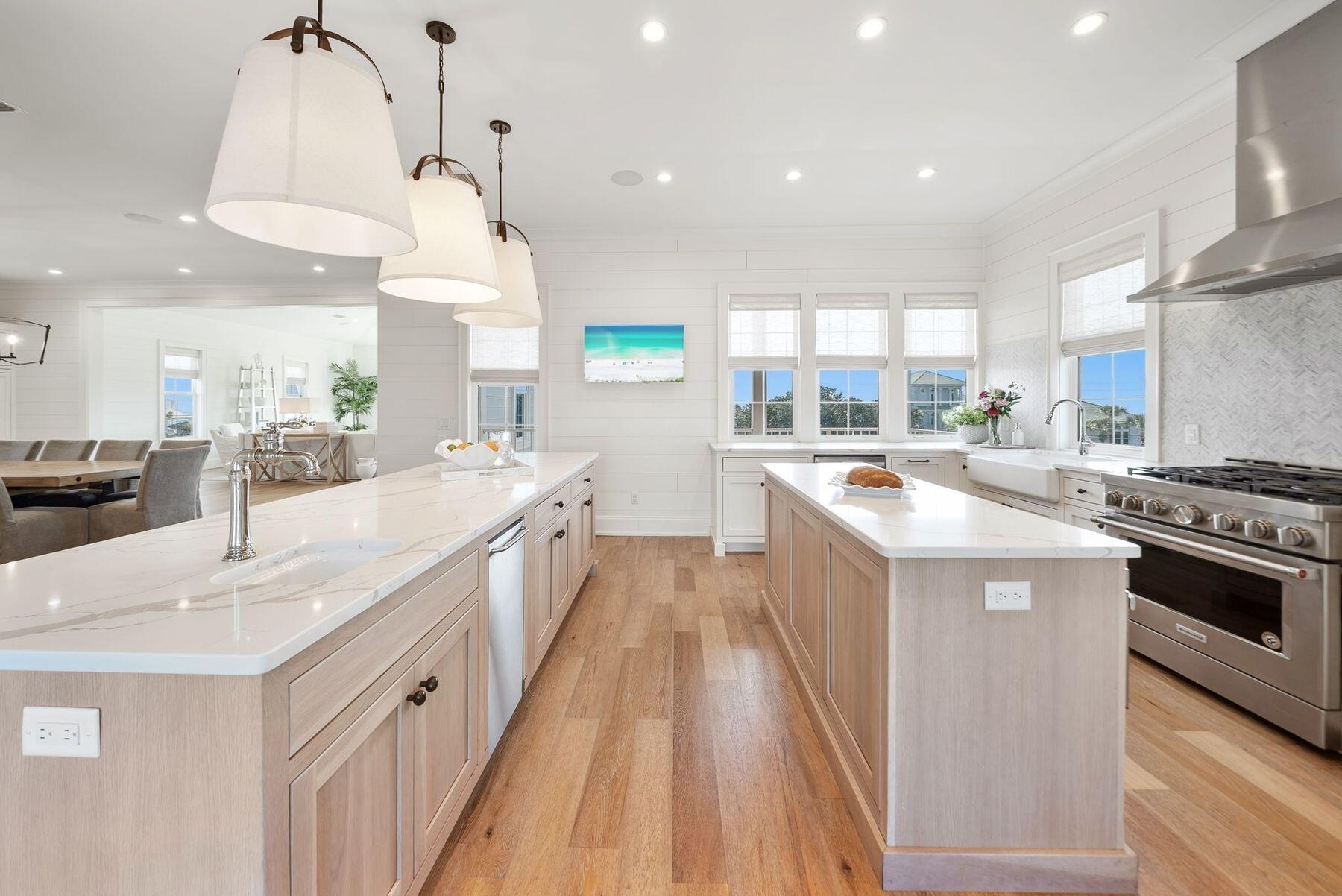 This well-appointed 7-bedroom, 7 full-bath, 3 half-bath coastal residence offers an exceptional blend of space, functionality, and prime 30A location--with no HOA and just a short walk to two public beach accesses. Thoughtfully designed for comfort and versatility, the home features two bunk areas, two separate living rooms, and multiple balconies, creating generous gathering spaces while still allowing for privacy--ideal for hosting large groups. Set on an oversized lot, the outdoor living experience is a true standout. A large heated pool, summer kitchen, and private backyard oasis shaded by mature oak trees provide the perfect setting for relaxed afternoons and evenings after the beach. The third-floor living room and kitchen serve as the heart of the home, capturing stunning Gulf views and offering a natural space for entertaining. Anchored by a 14-person dining table and ample bar seating, the chef's kitchen is equipped with stainless steel appliances, custom cabinetry, abundant storage, and designer finishes that balance style with functionality. An elevator offers convenient access to all three levels. The first floor includes a spacious mudroom with built-in cubbies and a washer and dryer, while two additional laundry areas on the upper levels make hosting guests effortless. Ideally located on the east end of 30A, between Alys Beach and The Big Chill, you're moments from dining, boutique shopping, and entertainment. With proven rental performance generating approximately $270,000-$315,000 annually, this property presents a compelling opportunity as a second home or investment along one of 30A's most sought-after corridors.