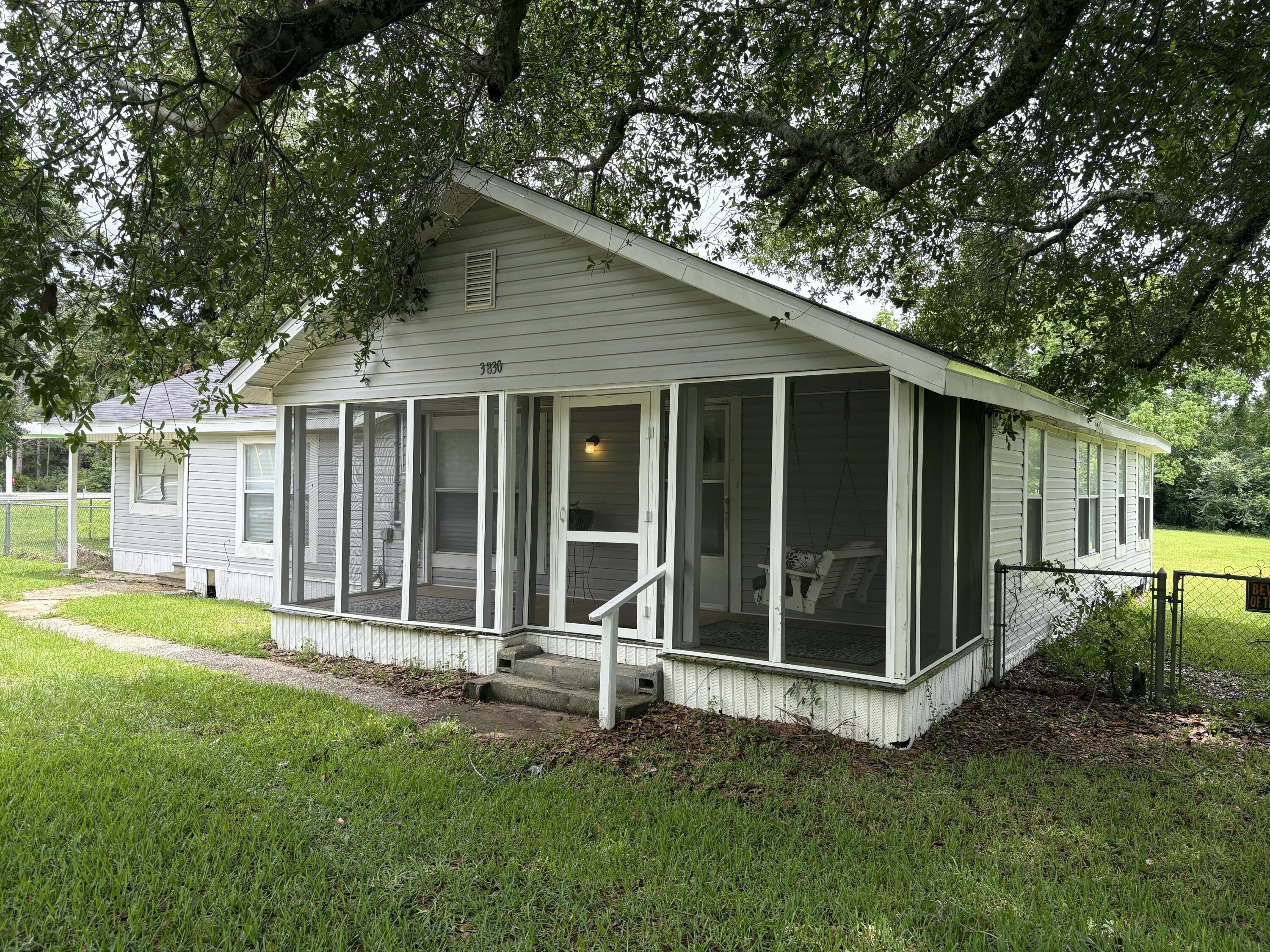 Charming and spacious 3-bedroom, 1-bath single-family rental offering approximately 1,400 square feet of comfortable living space! This home features a welcoming screened front porch--perfect for relaxing with your morning coffee or unwinding in the evenings. Situated on a large lot, there's plenty of outdoor space to enjoy. Inside, you'll find a functional layout with generous room sizes and cozy charm throughout. Conveniently located and move-in ready. Small pets will be considered with owner approval. Don't miss this opportunity to enjoy peaceful living with extra outdoor space! Limited Service, Contact owner directly for showings and applications- 850-791-2380.