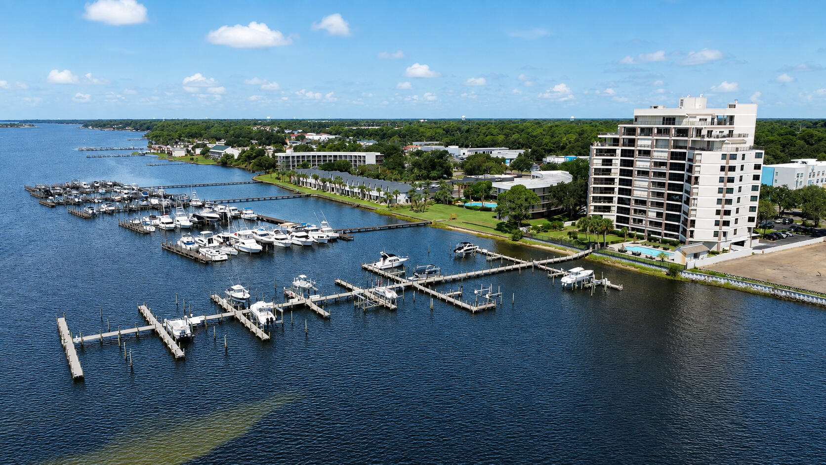 WATERFRONT LIVING WITH A PRIVATE 40' BOAT SLIP! Welcome to Unit 302 at Two Hundred West, an exceptionally spacious 2-bedroom, 2-bath condominium overlooking the Santa Rosa Sound. Located on the building's fourth floor--the third residential level above the ground-floor lobby and parking--this approximately 1,670-square-foot residence offers the space and comfort of a home combined with a relaxed waterfront lifestyle. The unit also includes private Boat Slip #8, measuring approximately 18' x 40'.
Floor-to-ceiling windows fill the expansive living area with natural light while showcasing panoramic views across the Sound. Step onto the approximately 157-square-foot private balcony overlooking the waterfront community pool, where you can enjoy coastal breezes, passing boats and unforgettable sunsets. The primary bedroom also features direct Sound views and private balcony access, creating a peaceful waterfront retreat.
Several thoughtful updates are already in place, including luxury vinyl plank flooring throughout the main living area and an updated primary bathroom featuring a walk-in shower, bidet and double vanity. The large kitchen provides abundant space and connects to a versatile flex room that is ideal for a home office, dining area, hobby room or potential 3rd bedroom.
The condo presents an excellent opportunity for a new owner to renovate and personalize the remaining interior while building upon its generous floor plan, waterfront setting and existing improvements. Two Hundred West is a desirable non-rental waterfront community offering a community pool, dock, fishing access and elevators. Centrally located in Fort Walton Beach, the property provides convenient access to shopping, dining, downtown, Eglin AFB and Hurlburt Field, with the white-sand beaches of Okaloosa Island only minutes away. Bring your boat, your vision and your love of the water--this is a rare opportunity to create your ideal full-time residence or Emerald Coast second home.