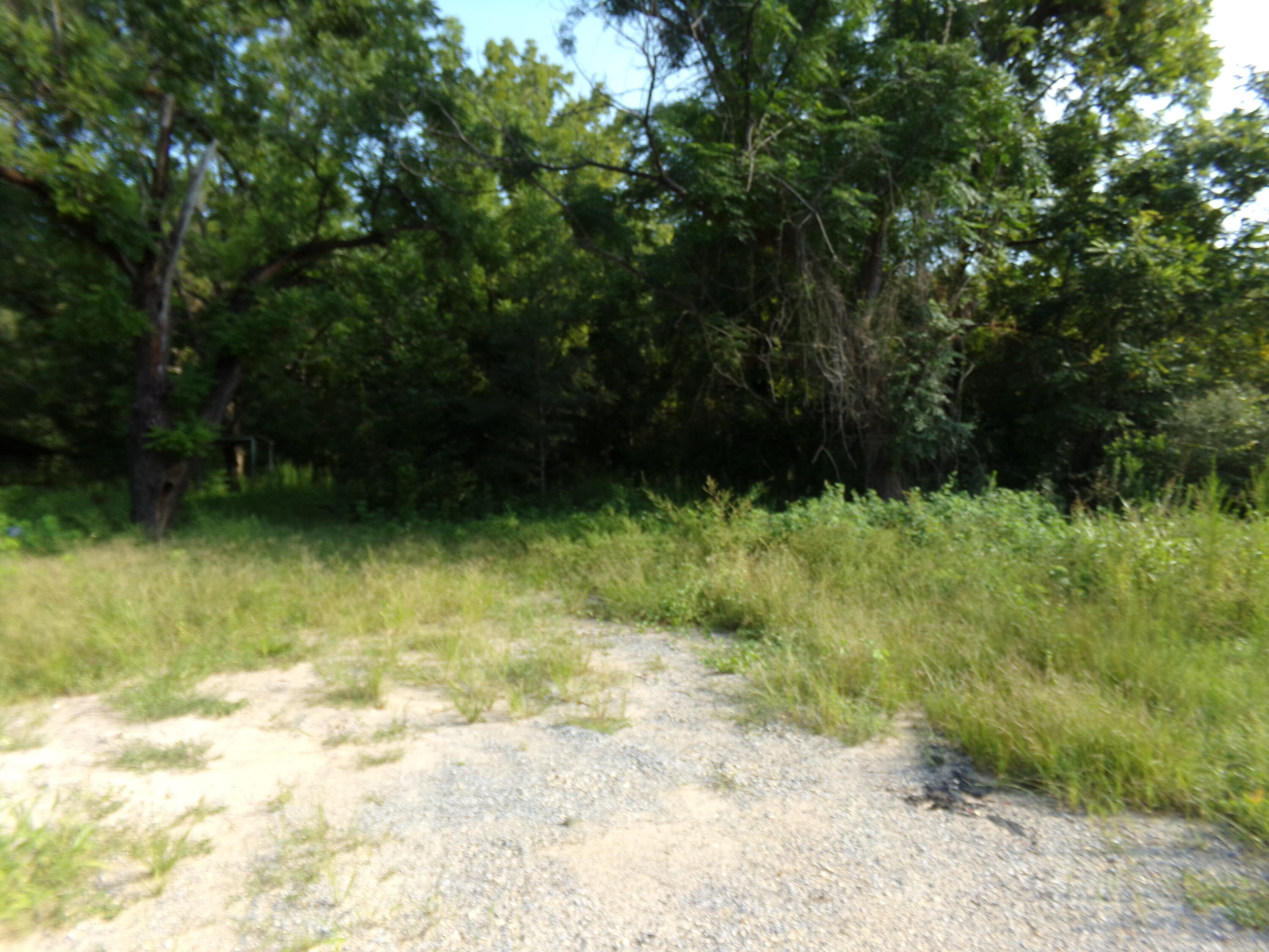 Three parcels, totaling ~4.4 acres next to new DSLD subdivision coming off Roberts Road~ Just past 2 large shopping centers and Post Office as well as High School and Middle school~ There is power and water to the 2-acre, front parcel~ Wonderful property to build your forever home or for investor / developer~ Close to shopping, post office, restaurants and schools~