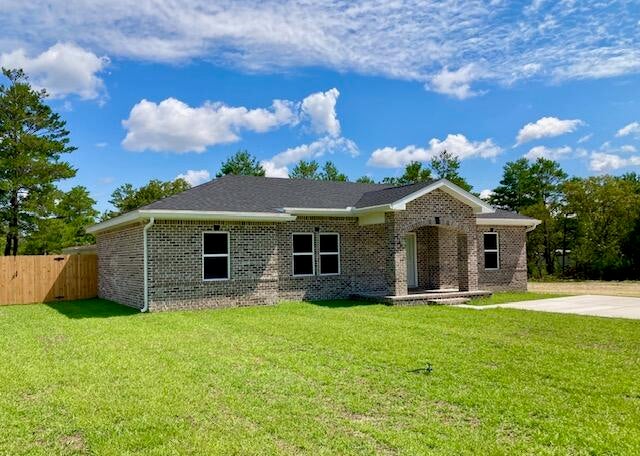 A CUT ABOVE! 3BR 2BA ALL BRICK HOME. Blackjack Properties has gained a reputation in Mossy Head for building houses with many custom upgrades at spec home pricing! Quartz countertops & a tankless gas water heater for continuous hot water. Stainless Whirlpool appliances (including a refrigerator!) All wood Shaker style cabinets, crown molding, and 9-foot ceilings in the main living area will delight any new home buyer. Kitchen & bath faucets are brushed nickel, and tall toilets are upgraded ADA compliant. All interior & exterior walls are insulated for soundproofing. The entire attic has spray foam insulation. The back yard has a 6' PT privacy fence and there are front rain gutters plus an oversize concrete parking pad & asphalt driveway. Yard is completely sodded, front & back. 1-Year Builder Warranty. This brand new brick home with a hip roof will save you a bundle in homeowner's insurance costs. The adjoining Lot 13 (.23 acre) is also cleared and available if purchased with the house at an additional cost. This property is a must see!