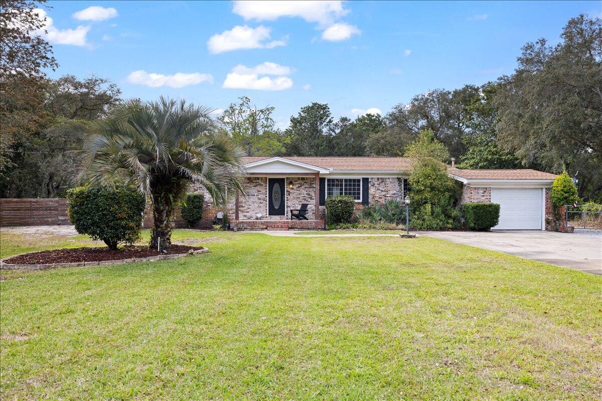 **Under contract but bring back-up offers** write us an offer! Beautifully remodeled pool home situated on a large, fenced half-acre lot with NO HOA in highly sought-after West Destin! This spacious property perfectly combines modern style, comfort, and functionality with an open-concept floor plan designed for both entertaining and everyday living. Lots of recent updates such as a new waterheater installed May 2026 and HVAC in July 2026!The stunning contemporary kitchen has been beautifully updated and features hardwood KraftMaid cabinetry, gorgeous Dekton countertops, Frigidaire appliances, and an oversized breakfast bar perfect for gathering with family and friends. Abundant natural light fills the home, creating a bright and inviting atmosphere throughout.
The private primary suite offers a custom barn door entry and elegant French doors leading directly to the pool deck, creating the perfect private retreat. The luxurious primary bathroom was fully renovated in 2024, and the home also received new exterior siding the same year. Three additional bedrooms provide ample space for family and guests, including one bedroom with direct pool access and its own private half bath. Step outside to your own backyard oasis featuring an expansive paved pool deck, separate hot tub, and a massive fenced backyard complete with a workshop -- ideal for storing boats, RVs, golf carts, and all your outdoor toys. Bring your boat and RV -- Perfectly located for boating and outdoor enthusiasts, 809 Jupiter Street is within 10 minutes or less of several of Destin's premier waterfront parks and boat launches. Joe's Bayou Boat Launch offers quick access to Crab Island and Choctawhatchee Bay, while Destin Marina Harbor Launch provides immediate access to the Destin Harbor. Nearby parks including Captain Leonard Destin Park and Liza Jackson Park offer paddlecraft launches, playgrounds, waterfront access, and family-friendly amenities.
Conveniently located near Destin's world-class beaches, less than one mile from Destin Elementary, approximately two miles from Target, and just minutes from shopping, dining, boating, and entertainment, this exceptional property offers the perfect combination of privacy, space, and coastal living.