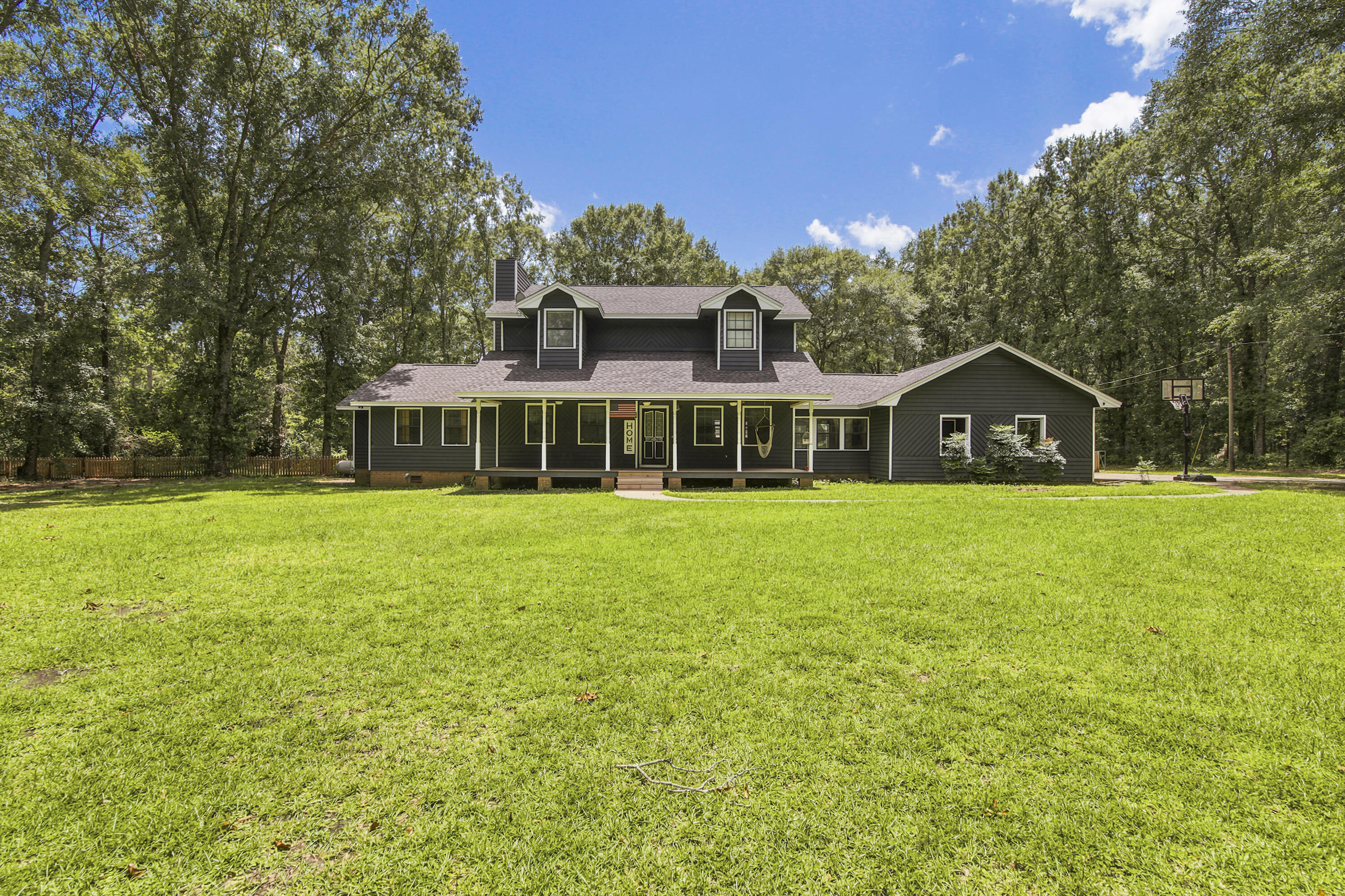 Amazing, updated 4BR 31/2 BA home on 3.36 acres located just outside of town but still in city limits this home offers a total kitchen remodel in 26 featuring granite countertops, a large island, all new premium appliance, an 8-burner gas double oven, dishwasher, &refrigerator. Additional upgrades include new bamboo flooring, new tankless hot water heater and a new roof and HVAC system in 2021.The exterior of the home was painted in 2020. Hardwood floors extend throughout the home, the upstairs, and new carpet in 1 bedroom for added comfort. Every BR includes a walk-in closet, offering tons of storage. The home has a living room with focal fireplace, separate dining, a great sunroom, large laundry, and a perfect area for playing or reading downstairs. The home sits back from the road for privacy and includes large covered front porch, a great back deck, a salt water inground pool and plenty of room to run and play as well as room for a garden. Move in Ready! Call today!