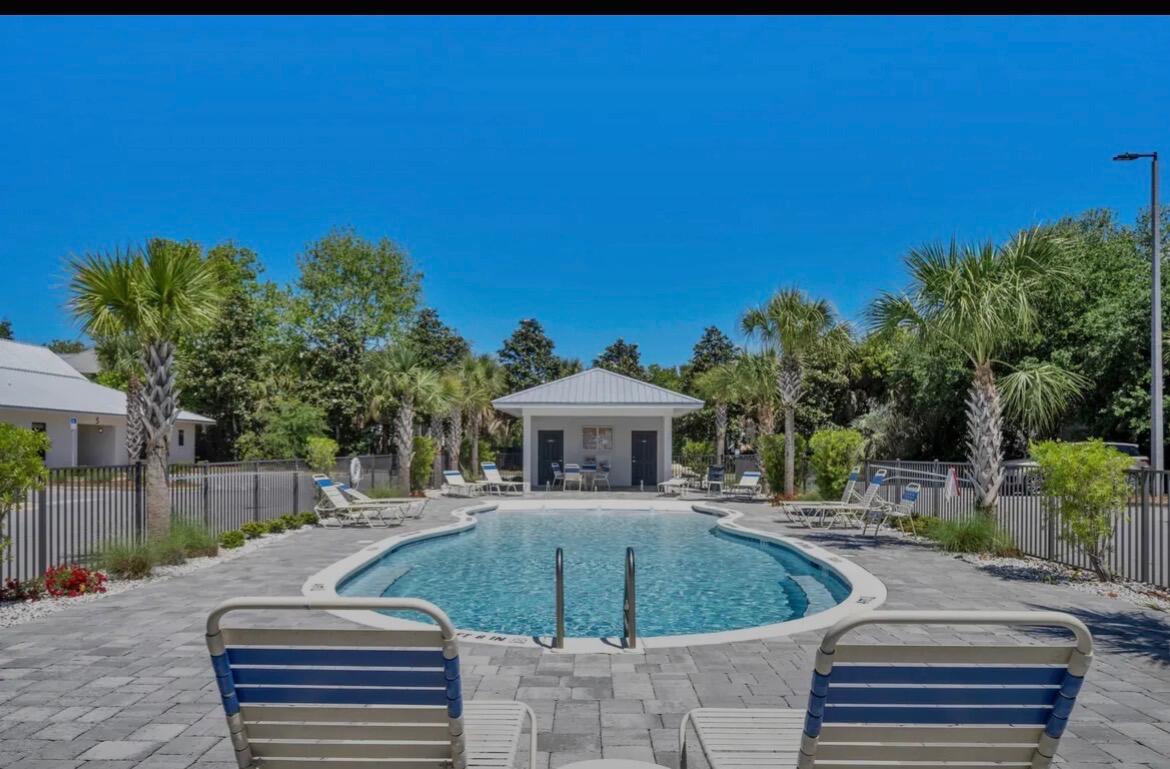 Location! Location! This incredible 2 BR 2 BA Hidden Lake Condominium ground floor, end unit is in a prime location on the West end of Scenic 30-A. Hidden Lake features a modern 'Zero Entry' pool, Fitness Center; BBQ grills  and plenty of overflow parking.  Complex has WiFi internet included, and pets are allowed with restrictions. Interior boasts 9' ceilings, LVP flooring, granite counter tops throughout; stainless appliances; washer & dryer; Walk or bike to all of the amenities of nearby 30A Shopping and Restaurants. This one won't last long, so come see it today!  Tenant to verify all information.