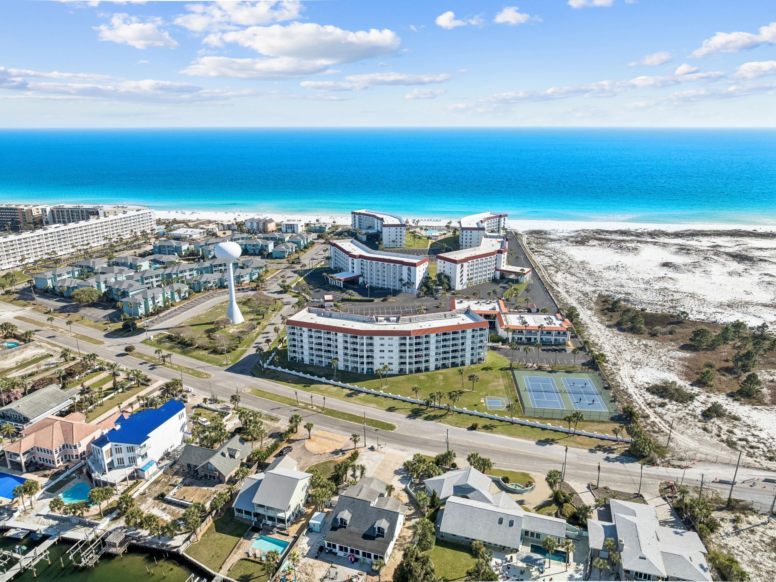 Experience the best of the Emerald Coast from this beautifully updated, fully furnished turnkey condo located in the highly sought-after El Matador on beautiful Okaloosa Island. Enjoy stunning direct bay views from your private balcony while being just a short walk from the sugar-white beaches and emerald waters of the Gulf.

This coastal retreat is ideal as a full-time residence, vacation getaway, or investment property with proven rental history and convenient on-site rental management. Recent updates include new kitchen cabinets, countertops, appliances, fresh paint, updated flooring, window treatments, and a new sliding glass door. Offered fully furnished and move-in ready, this condo allows you to immediately begin enjoying the coastal lifestyle.

Residents and guests enjoy resort-style amenities including a gated community, two pools with one heated, hot tub, tennis courts, exercise room, and close proximity to deep sea fishing, golf, shopping, dining, and entertainment in both Fort Walton Beach and Destin. Don't miss this opportunity to own your piece of paradise on the Emerald Coast.
