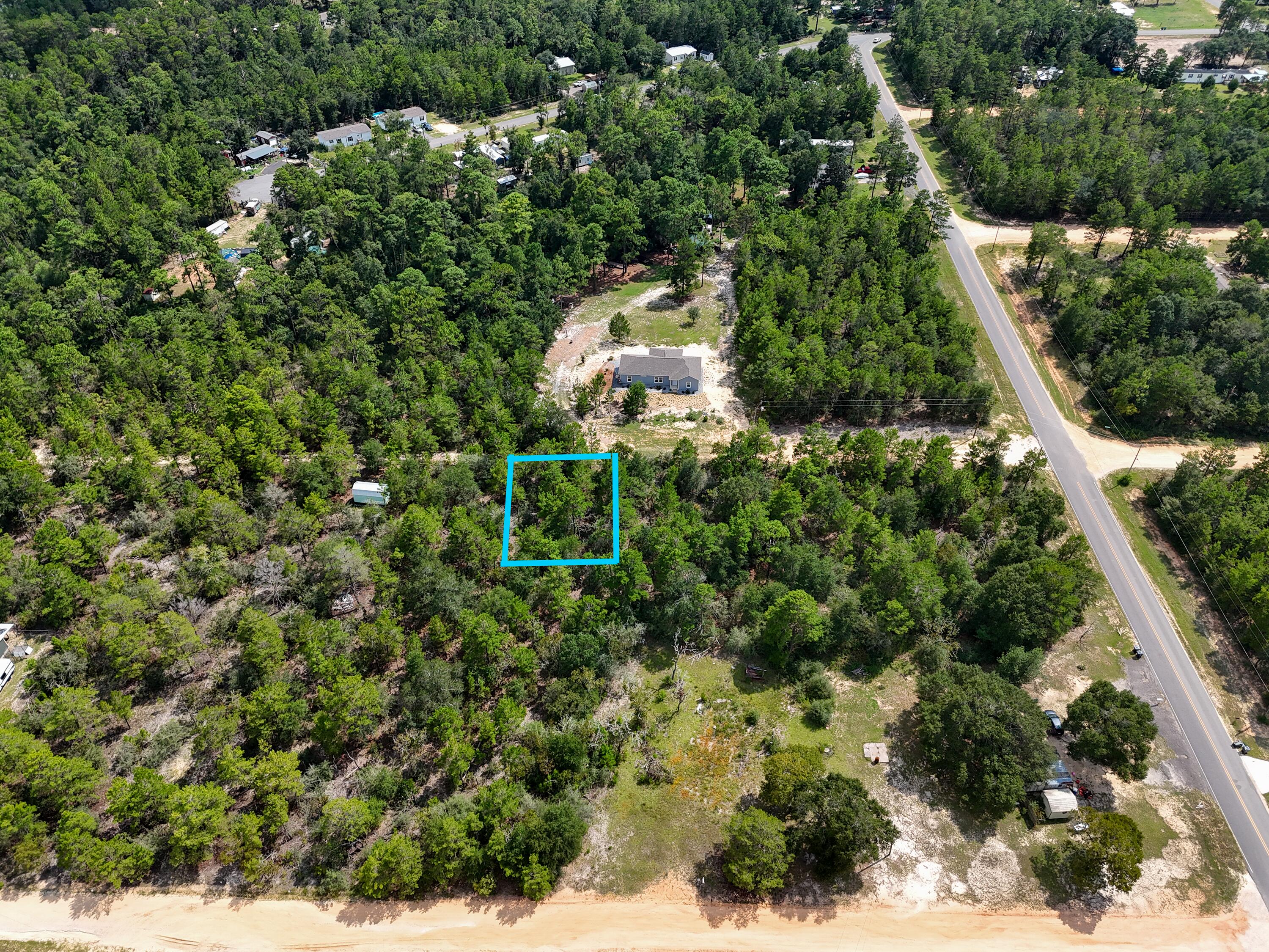 If you have been sitting back watching the market for a deal here it is! Almost 1/4 of an acre for ONLY $14,900k with an additional lot available. Located just off HWY 90 allows for a easy commute to town and to jobs. Loys at this price do not come along often. Mossy Head water available and Chleco Power just across the street makes getting utilities easy!  Property recently has a septic, but location is unknown on which lot it is on and seller has no knowledge of use capability. Grab this deal today!