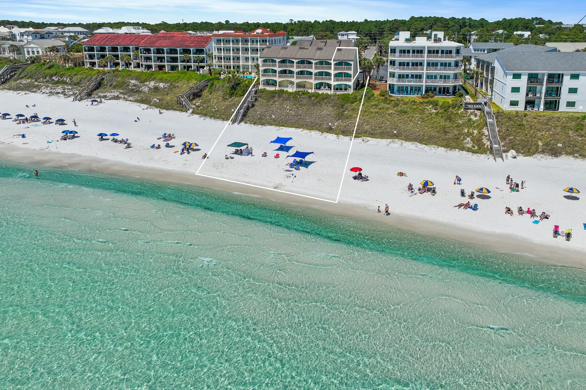 Prominently positioned to showcase the stunning views of turquoise-hued waters on 30A throughout the unit, this like-new and never rented, coastal retreat spans three distinct levels totaling over 1,800 square feet. Upon initial entry, you're welcomed by a hallway that opens into a spacious main living and dining area, featuring stunning Gulf views, a thoughtfully designed coastal color palette, and soaring ceilings accented by elegant wood-plank tile flooring. Step outside to the adjoining arched terrace, the perfect place for admiring the beautiful palate of mesmerizing hues with unobstructed 180-degree views. The fully renovated kitchen features a luxury appliance suite, stunning quartz countertops coupled with a stunning backsplash and new fixtures. The primary suite, tucked away on the second level, is a true sanctuary of relaxation. Floor-to-ceiling windows flood the space with natural light and frame sweeping, unobstructed views of the beach and Gulf. Step out onto your private Gulf-front balcony to feel the ocean breeze and listen to the soothing rhythm of waves crashing along the shore. The spa-like ensuite features dual vanities, a walk-in wet room and custom cabinetry providing additional storage options. Just down the hall, the guest suite offers 2 full size beds, a private bath and terrace overlooking the community's pool. The top floor loft quarters boast two twin size beds and is perfect place for the teenagers and kids to hang out.

This, fully furnished end-unit has been immaculately maintained and features tons of premium upgrades to include all new high impact windows and sliders, furnishings, fixtures, a new washing machine and dryer, new AC (2021) with integrated UV air filtration, professionally cleaned ductwork, a new water heater (2018), and is equipped with automatic hurricane shutters that were recently serviced, and much more.

The low-density community of Seagrove Dune Villas is tucked away in the heart of Seagrove Beach sprawling on nearly two acres and located further away from the public beach accesses, providing a more intimate and private setting..The complex is well maintained and just completed some recent updates which include adding dedicated golf-cart parking, landscaping rejuvenation, newly painted exterior, a newly resurfaced pool to include new pool loungers, a newly rebuilt boardwalk and paver path to the beach, and much more!
The culmination of luxury and exclusiveness creates a truly intimate setting while remaining geographically poised near all of the acclaimed dining and entertainment venues 30A has to offer and is just one mile east of Seaside! Impressive rental potential with projections over $115,000 per year and basically all-inclusive dues makes this a compelling opportunity for both investors and second-home residents alike. Inquire today and start living the coastal lifestyle.