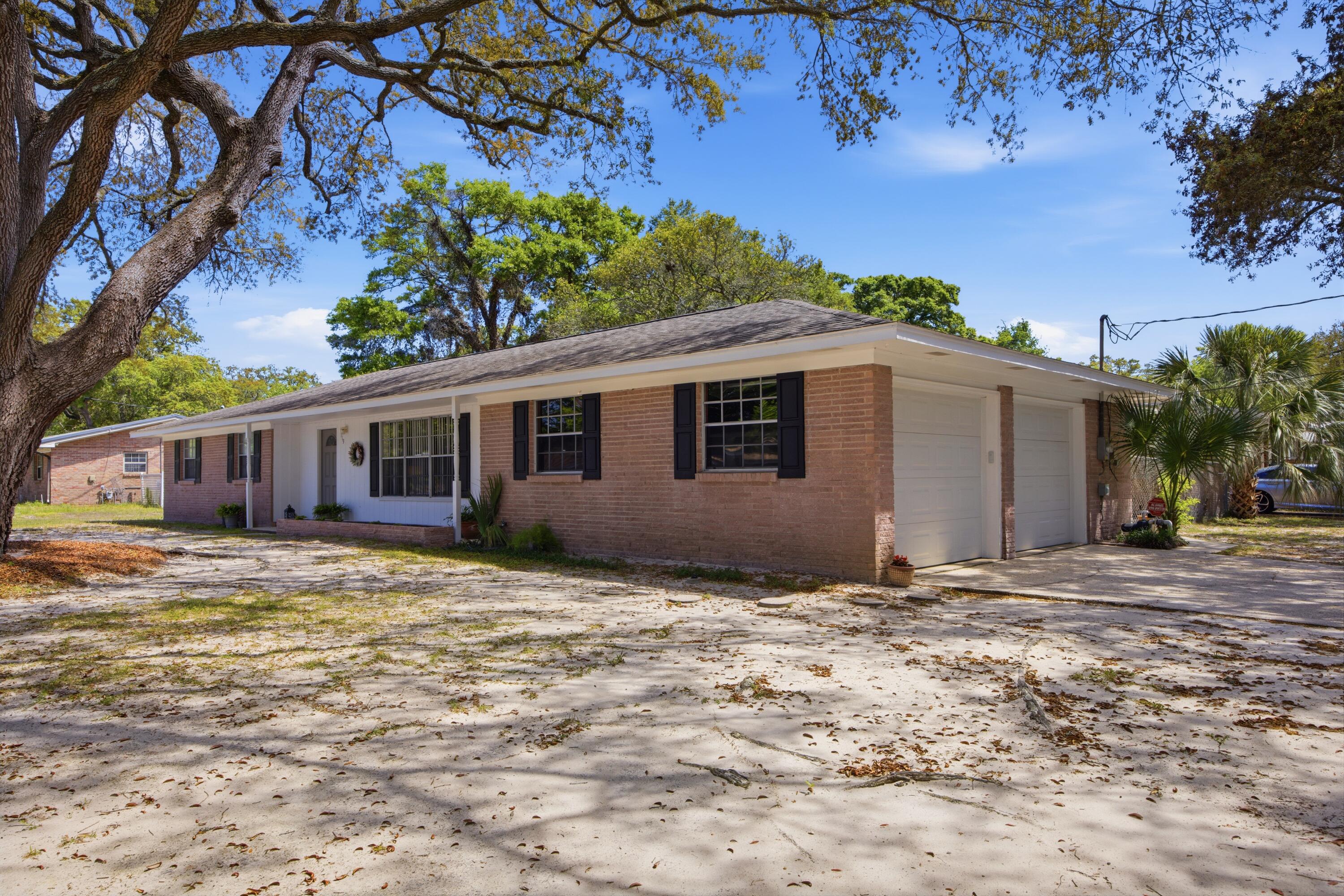 Back on the Market no fault of seller. Perfect for buyers seeking both convenience and peace of mind, this well-maintained home at 119 Jamestown Ave offers a prime central location in Fort Walton Beach, just minutes from Hurlburt Field, Eglin AFB, beautiful Gulf Coast beaches, and highly rated zoned schools. Inside, you'll find a home that has been thoughtfully cared for with numerous system upgrades already completed for you. The HVAC system (2019) and has been consistently maintained, including recent updates to key components in 2022, 2024, and 2025, along with professional duct cleaning. Major plumbing improvements include a new hot water heater (2023), updated fixtures throughout, resurfaced bathtub, and a full replacement of the main water line with durable PEX piping, plus a newly installed water pressure regulator. Electrical updates include a replaced panel (2019) and routine system checks, offering added confidence in the home's infrastructure. Additional interior touches such as updated toilets, a modern kitchen faucet, and a new bedroom ceiling fan enhance everyday comfort, while exterior upgrades including a new front door, automatic garage door opener, full window screen replacement, and an irrigation system with lawn pump, add both function and curb appeal. The 2-car garage offers a workshop-style setup with built-in benches and shelving ready for your next project.  Mature live oak trees have also been professionally pruned, enhancing the beauty of the property. Whether you're commuting to base, heading to the beach, or enjoying the nearby schools and amenities, this home delivers an ideal blend of location, upgrades, and livability.