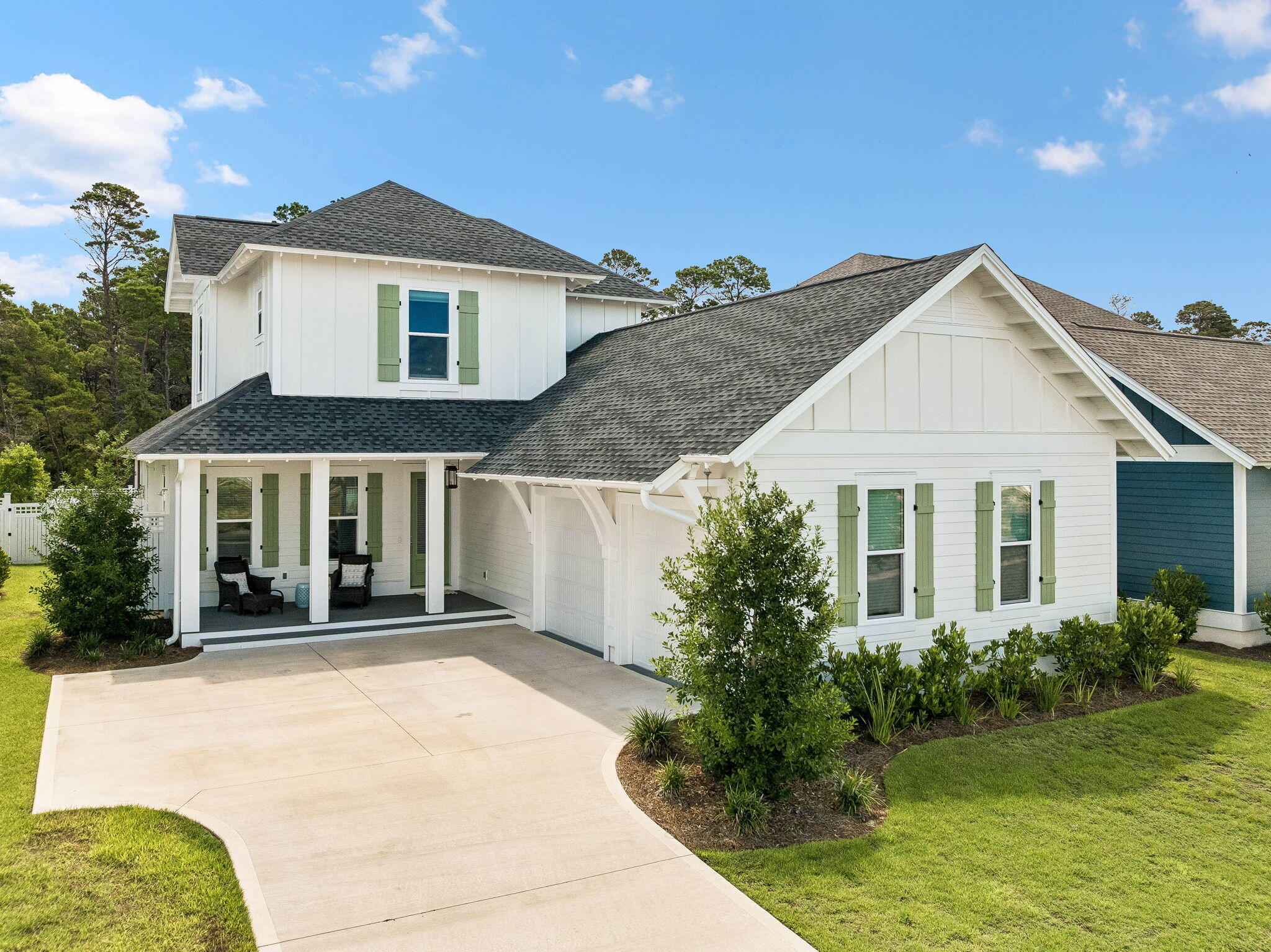 Built in 2025, this exceptional home offers the rare opportunity to own a virtually brand-new residence featuring a highly desirable FIVE-BEDROOM floorplan--an uncommon find at this price point in Watersound Origins. Designed with both everyday living and entertaining in mind, the thoughtfully planned layout offers 2 spacious bedroom suites on the 1st floor in addition to a versatile front bedroom that can easily serve as a home office, flex room, or guest suite. The private primary suite is tucked away at the rear of the home, creating a peaceful retreat complete with a luxurious spa-inspired bath featuring an oversized walk-in shower with a rainfall shower head and a custom-designed walk-in closet with built-in storage cubbies. Upstairs, 2 additional bedrooms each enjoy their own private en suite bathrooms, providing comfort and privacy for family and guests alike.
The welcoming foyer opens to an airy, light-filled living space complemented by an elegant dining area and an oversized storage closet--perfect for seasonal décor, luggage, and everyday organization. Expansive windows throughout the home flood the interior with natural light, enhancing the open-concept design.
At the heart of the home, the chef's kitchen showcases ceiling-height light tan cabinetry, under-cabinet lighting, elegant vertical fluted panel detailing on the oversized island, seating for four, and abundant storage with two walk-up pantries. Premium THERMADOR appliances include a 36-inch Thermador gas range with matching hood, microwave drawer, and refrigerator, making this kitchen as functional as it is beautiful.
The kitchen flows seamlessly into the spacious living room, where a shiplap-accented fireplace creates a warm and inviting focal point for gathering with family and friends.
Additional upgrades throughout the home include custom designer lighting, wide-plank luxury vinyl flooring, and a well-appointed laundry room featuring extra shelving and a convenient hanging rod. An outdoor shower with a private fenced enclosure offers the perfect place to rinse off after a day at the beach.
One of the home's most appealing features is the screened porch overlooking a large, fenced backyard that backs to a peaceful stand of towering pines. With ample space to accommodate a future pool, this private outdoor setting provides endless possibilities for creating your own backyard oasis.
Offering the ideal combination of modern construction, exceptional design, generous living spaces, and premium finishes, 123 E Pollard Cove presents an outstanding opportunity to enjoy the Watersound Origins lifestyle in one of the community's newest homes.