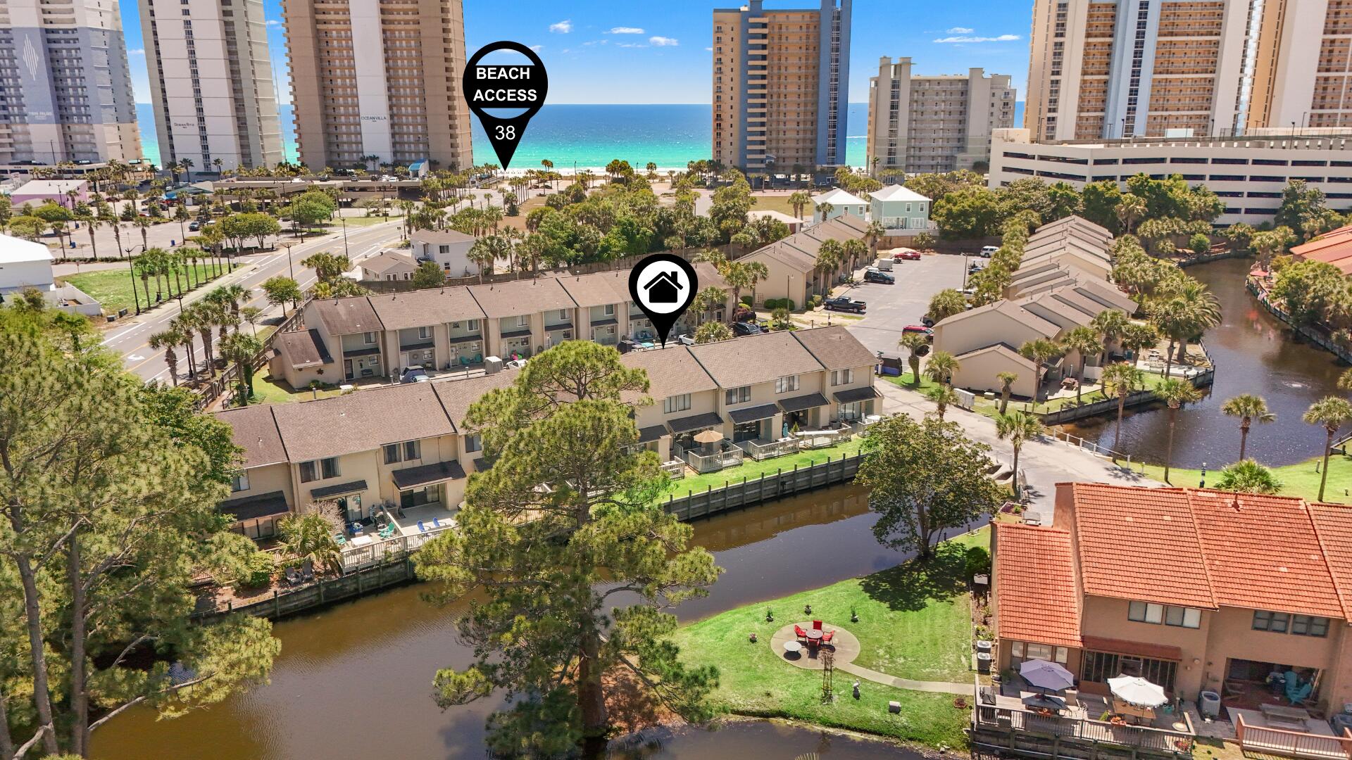 WATERFRONT... walk to the beach, fully furnished... and a golf cart INCLUDED.
Yes, you read that right. This canal-front townhome offers peaceful water views where you can watch turtles swim and birds catch fish right from your back patio. It's a larger floor plan with a glass-back design, giving you great views from the main living area and the primary bedroom. Located in a prime spot directly across from a heated pool (seasonal) and just a short walk to the sand, with two convenient beach accesses nearby--the private community access on the west side and public beach access #38 on the east. Inside, the unit shows great and has been well taken care of. Features include granite countertops in the kitchen and a tiled walk-in shower in the primary bathroom. The large window in the primary bedroom overlooking the canal is a standout feature. Sold fully furnished and ready to enjoy or rent right away. Additional highlights: Short-term rentals allowed with strong GRI potential, VA & FHA approved, Low HOA, 2 assigned parking spaces right in front, Golf cart included.
The community amenities are hard to beat and included in the HOA ($1,121.84 per quarter, not monthly):
11 pools (5 heated), private beach house with beachfront pool and snack bar, tennis, pickleball, shuffleboard, fitness center, 18-hole mini golf, playgrounds, conference center, plus internet, lawn care, trash, pest control, and termite bond. Golf carts are welcome, making it easy to get around the community or head to the beach.
Whether you're looking for a full-time home, beach getaway, or investment property, this one checks all the boxes.