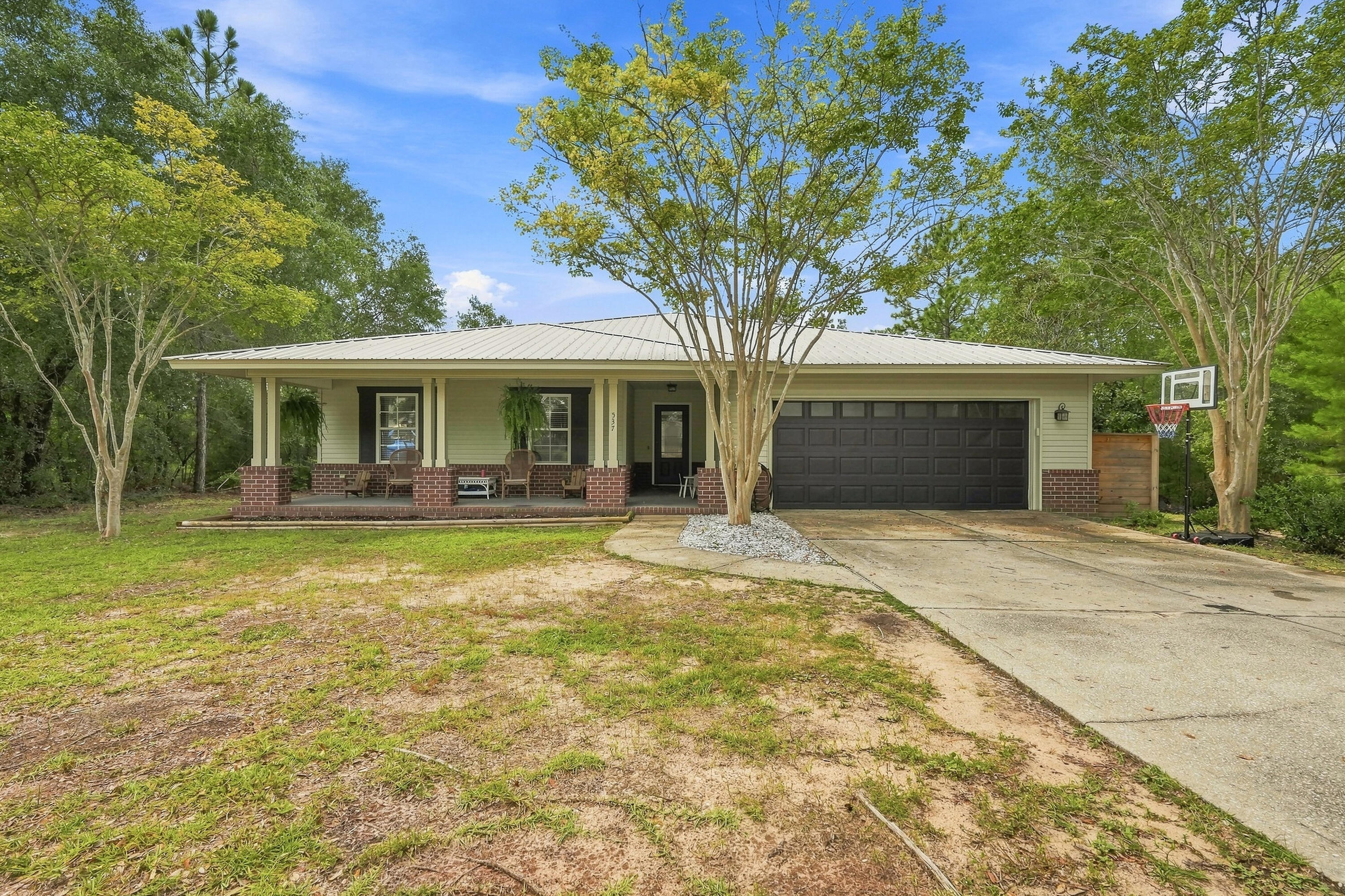Discover comfortable living in this charming 4-bedroom, 2-bathroom home nestled in the heart of DeFuniak Springs. Boasting 1,719 square feet of well-appointed space, this property features metal roof, new HVAC system and brand-new appliances, setting the stage for a move-in-ready experience. The primary bedroom offers a serene retreat after a bustling day.  With open concept, this home has plenty of room for entertaining and expands to large screened in back porch.  The 4th bedroom could be used as an office or playroom. The possibilities are endless and you will see from the moment you step in that the home has been well maintained.  Make an appointment today and come see all the unique touches to this property and discover what makes this the perfect place to call home.