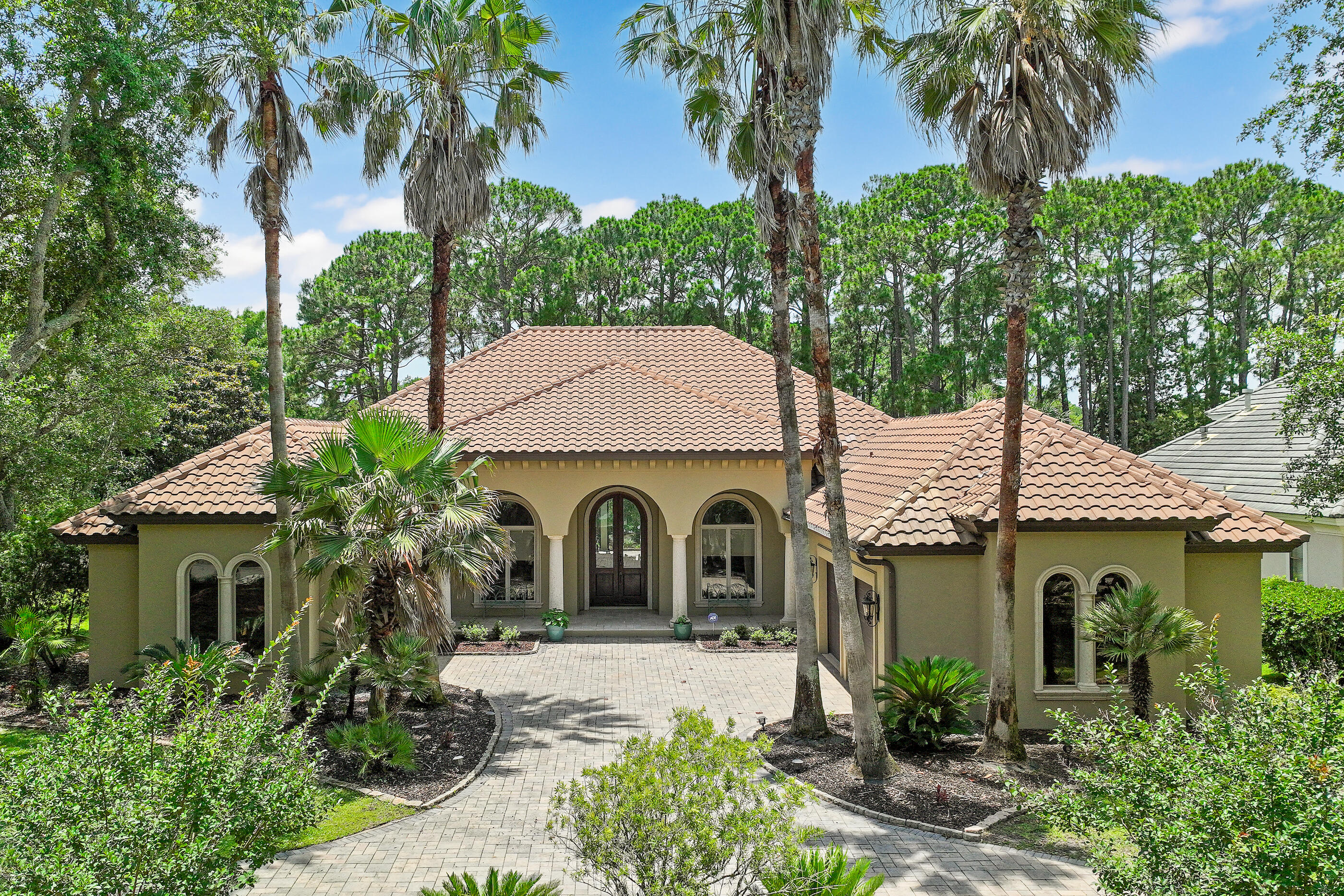 Luxury living in the gated golf and boating community of Regatta Bay! Situated on a spacious .66-acre corner lot, this impressive 3-bedroom, 2.5-bath home offers over 3,400 sq.ft. of heated and cooled space with stunning golf course and lake views. Designed for both comfort and entertaining, the home features tall ceilings, a split floor plan and expansive indoor-outdoor living with two fully retractable sliding glass door systems. The heart of the home is a gourmet kitchen with new quartzite countertops, new appliances including a Café gas stove, dual door oven, wine fridge, updated fixtures and a breakfast area, all opening to the family room with a gas fireplace and views of the outdoor living space. Additional living areas include a formal living room, dining room and dedicated office. The private primary suite offers a sitting area, wet bar, oversized walk-in closet with new flooring and shelving and a spacious en-suite bath with a separate shower and large whirlpool tub. Guest bedrooms are connected by a Jack-and-Jill bath, providing both convenience and privacy. Step outside to your screened lanai with a newly updated pool, summer kitchen and tranquil backdrop of natural pine trees for added privacy. Recent exterior upgrades include pool resurfacing and tile, new pool pump and salt system, new fans, stucco paint, and outdoor lighting. Additional features include a 3-car garage, staircase access to attic storage and a well-appointed laundry room with sink and cabinetry. Major mechanical update includes a new heat pump. Located in one of the area's most desirable communities, this home combines privacy, space, and resort-style living with easy access to amenities. Regatta Bay is a serene, gated community that seamlessly blends golf and boating, offering a lifestyle that is truly unparalleled! The essence of the Regatta Bay Lifestyle revolves around convenience, allowing residents to easily access numerous enjoyable destinations within minutes via golf cart, including the beach! Within the community, residents can indulge in golf, swimming, tennis, pickleball, parks, playgrounds, the Regatta Bay Clubhouse, Legendary Marine, and Legendary Yacht Club. Furthermore, Regatta Bay features a private road that leads directly to the Destin Commons, where an array of popular retail stores for both men and women awaits, alongside a diverse selection of restaurants, Whole Foods, Bass Pro, Lowes, an AMC movie theater, and Uncle Buck's Bowling-all easily reachable by golf cart. Regatta Bay is centrally located offering easy access to the airport and only a few miles from Northwest Florida's finest hospital. Schedule your private tour today and experience the elegance of Regatta Bay living.