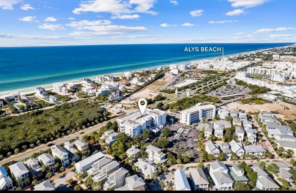 Wake up where the rhythm of 30A unfolds just outside your door steps to the emerald waters and powdery white sand beaches. Perfectly positioned between Alys Beach and Rosemary Beach--and directly across from Paradise By The Sea--this corner end-unit residence at The Alexander gives you a front-row seat to luxury coastal living and top beachside cafes. Enjoy soaring 10-foot ceilings and floor-to-ceiling windows reflecting natural light, while the expansive living area invites effortless entertaining and relaxed seaside days. A rare 180 degree wraparound balcony spans two sides, extending the living space outdoors. The serene primary suite features its own balcony, walk-in closet, and a spacious en-suite bath with separate corner tub and shower. This 2BR 2BA As-Is condo is priced to sell and ready for a modern refresh. Recent updates include new luxury flooring, kitchen refresh with Quartz countertops and backsplash plus interior painting.  This would also make a great guest house for Owners at Alys, Rosemary or Paradise By The Sea. Don't miss your opportunity to make this 30A uniquely yours as a second home, investment short term rental or primary residence. This property enjoys its very own deeded beach access.