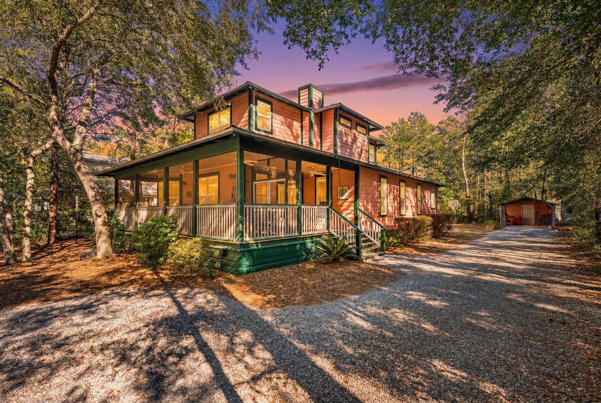 Just minutes from the beach, the Daughettes/Point Washington area is a peaceful, rural, and wooded community surrounded by towering pines, magnolias, and native scrub oaks. Tucked between the bay and the Gulf, this distinctive neighborhood offers a tranquil setting and a character all its own.

Thoughtfully designed for both everyday living and effortless entertaining, this home features an open-concept living, kitchen, and dining area on the main level, complemented by a convenient powder room and laundry room. A deep southern style screened-in front porch overlooks the low maintenance wooded front yard, offering a serene spot to relax and take in the beauty of the surrounding landscape.

The main-level primary suite provides privacy and convenience, while the second floor features two additional bedrooms, each with its own ensuite bath. With comfortable private spaces for family and guests, this home blends thoughtful design, natural beauty, and relaxed coastal living.

Oversized double garage with a fully air-conditioned workshop, perfect for hobbies, projects, or a dedicated workspace. Ample additional covered parking provides plenty of room for extra vehicles, boats, or trailers, making this property ideal for outdoor enthusiasts.